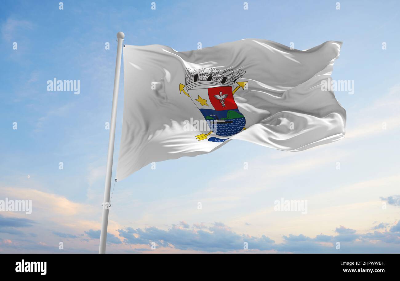 flag of Vitoria , Brazil at cloudy sky background on sunset, panoramic view. Brazilian travel and patriot concept. copy space for wide banner. 3d illu Stock Photo