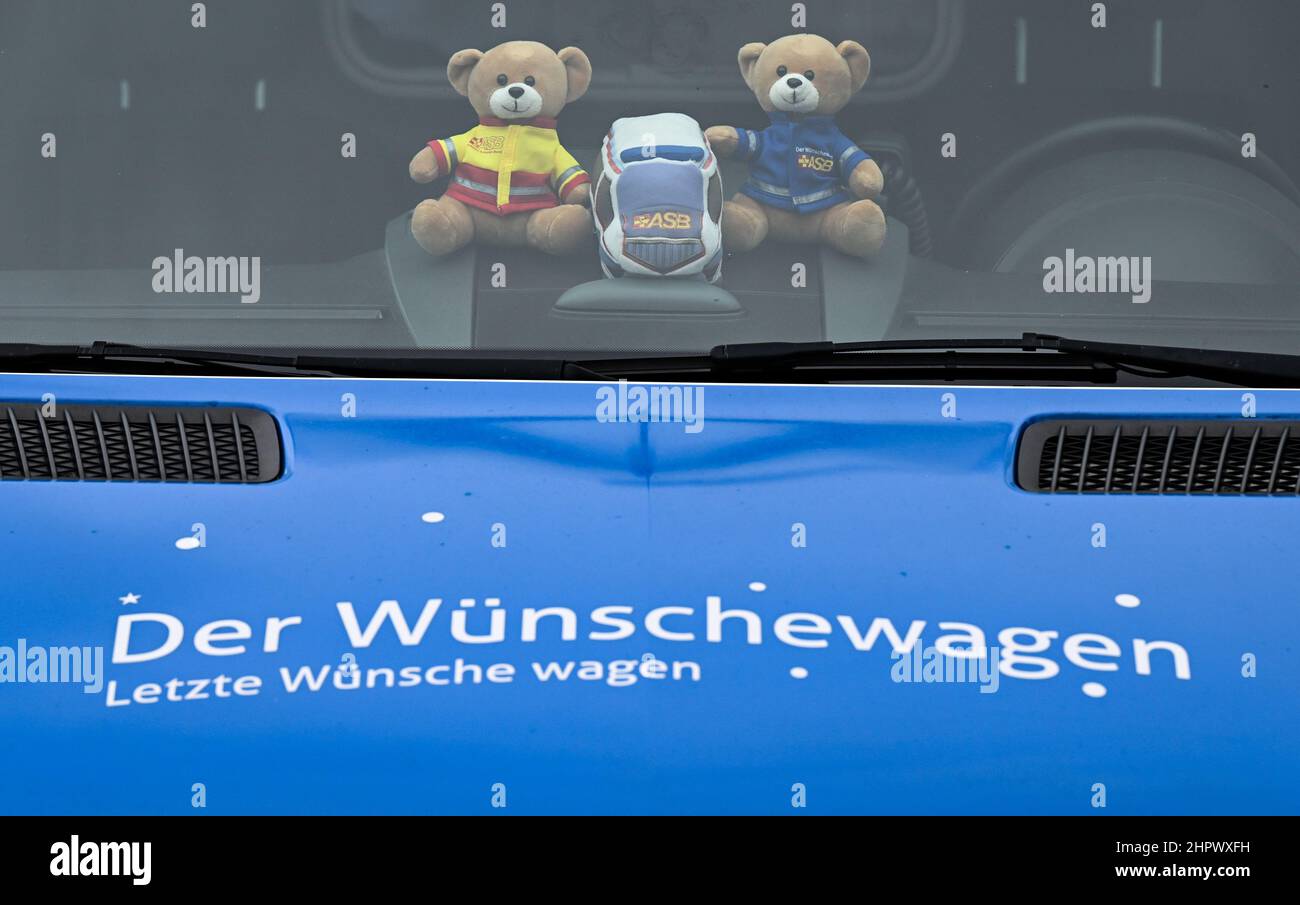 PRODUCTION - 22 February 2022, Hessen, Frankfurt/Main: 'The Wünschewagen. Last wishes dare' is written on the hood of the medically equipped vehicle of the Arbeiter-Samariter-Bund (ASB). The ASB's 'Wünschewagen' are on the road in all of Germany's federal states, taking terminally ill patients once again to the places they long for. The project was launched in 2014, and since then the volunteer supporters have made more than 2,000 wishes come true across Germany. The campaigns are financed exclusively by donations. Photo: Arne Dedert/dpa Stock Photo