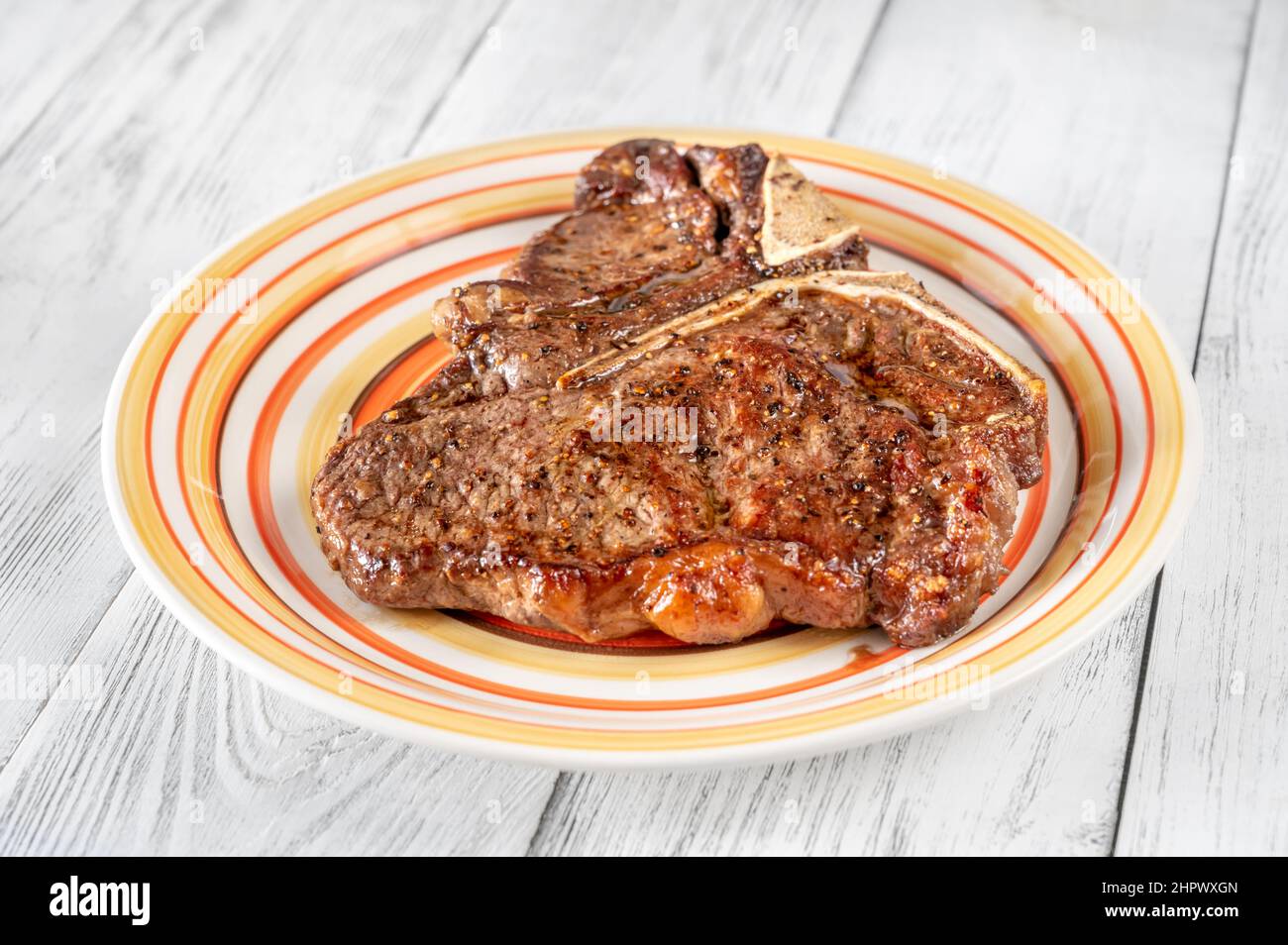 Panfried Tbone steak with pepper on the plate Stock Photo Alamy