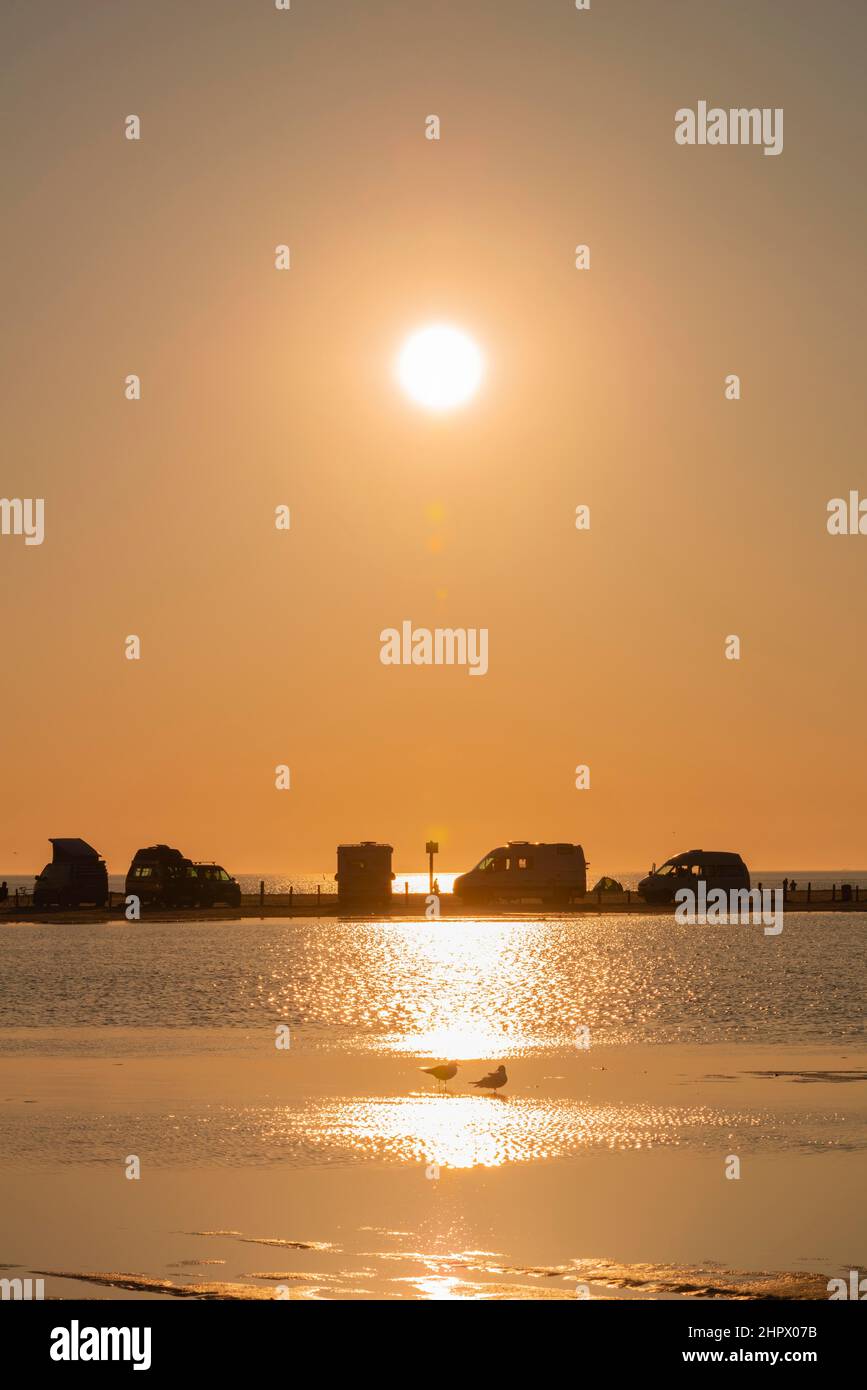 Camper on the beach in the sunset, St. -Peter-Ording, North Sea, Schleswig-Holstein, Germany Stock Photo