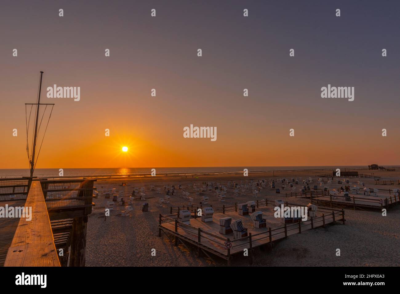 Beach chairs, beach at sunset, St. -Peter-Ording, North Sea, Schleswig-Holstein, Germany Stock Photo