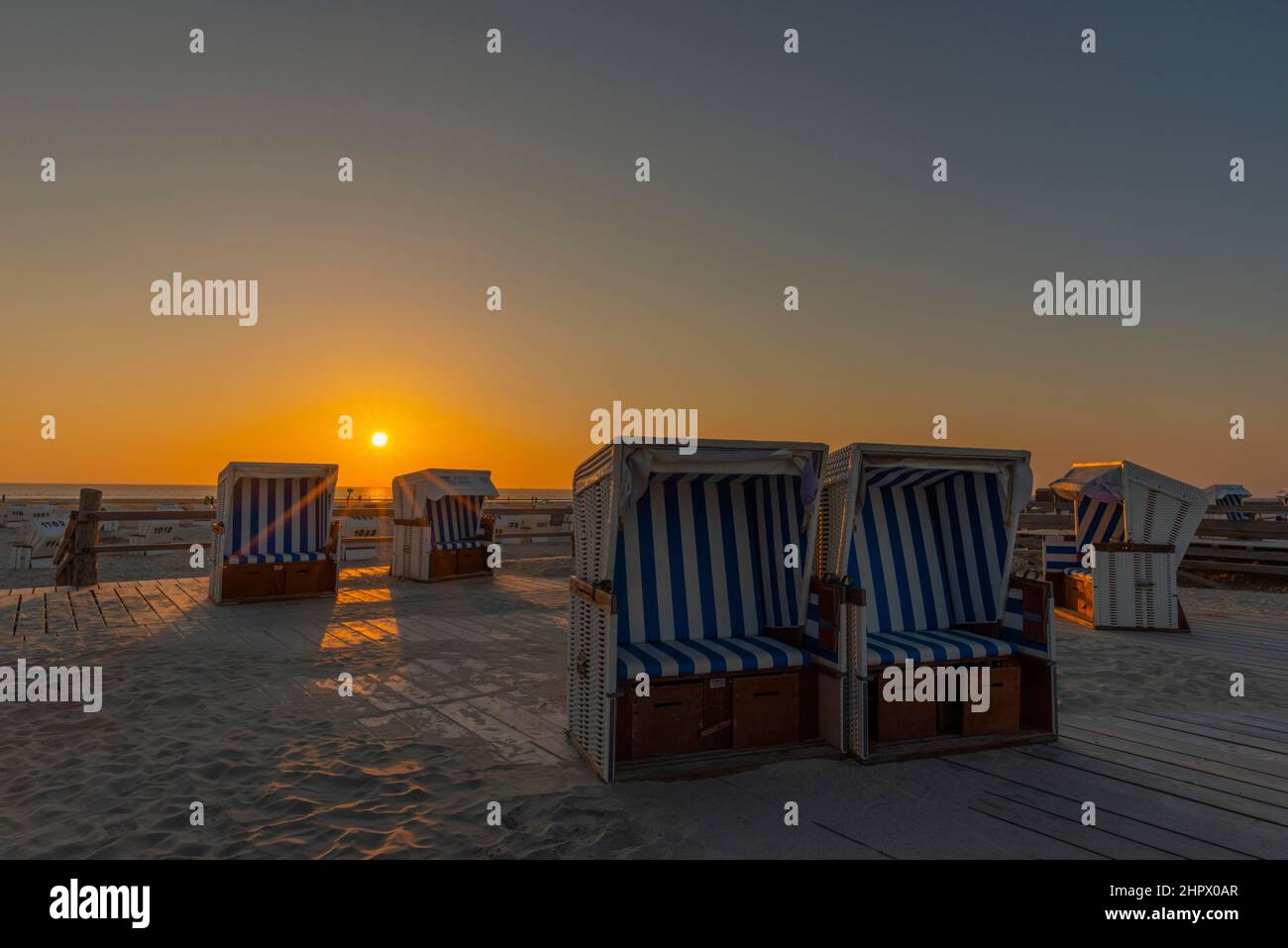 Beach chairs, beach at sunset, St. -Peter-Ording, North Sea, Schleswig-Holstein, Germany Stock Photo