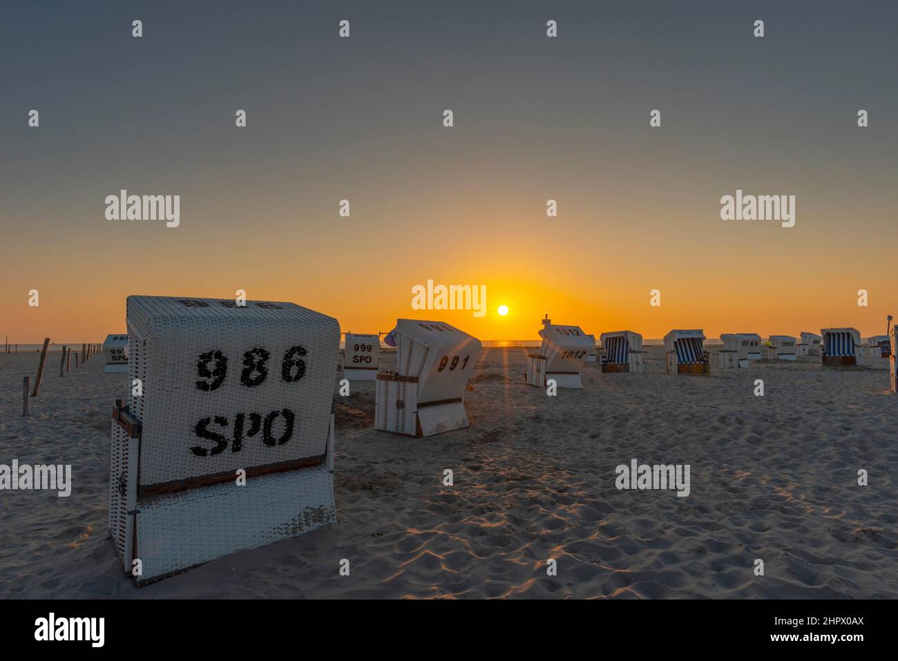 Beach chairs, beach at sunset, St. -Peter-Ording, North Sea, Schleswig-Holstein, Germany Stock Photo