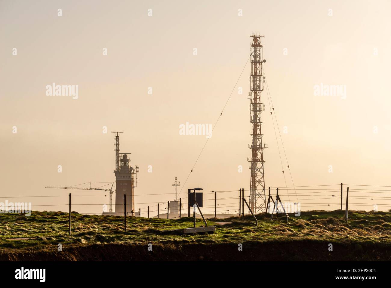 Lighthouse with radar antenna and radio tower in the evening light, Oberland, High Seas Island Helgoland, Pinneberg district, Schleswig-Holstein Stock Photo