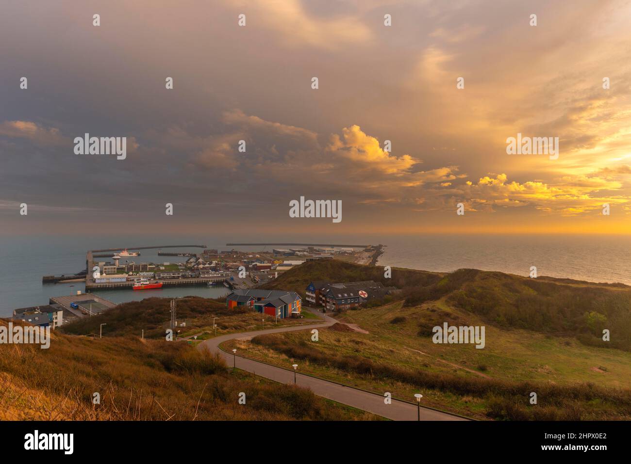 View of the harbour, rehab clinic, winter, evening light, cloudy sky, Helgoland, Pinneberg district, Schleswig-Holstein, Germany Stock Photo