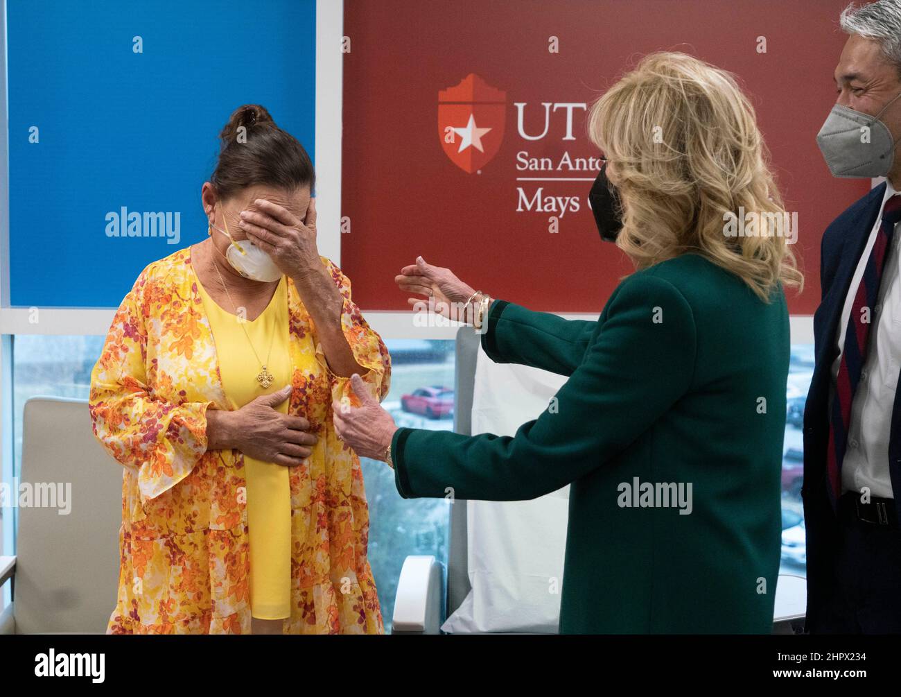 San Antonio Texas USA, Feb. 23, 2022: Cancer patient RAINEE MILLER, l, tears up as U.S. First Lady JILL BIDEN visits the Mays Cancer Center and gives her a hug during a tour of the UT Health MD Anderson Cancer Center in San Antonio. Biden listened to patients stories and heard from doctors on the front lines of the battle against cancer. Credit: Bob Daemmrich/Alamy Live News Stock Photo