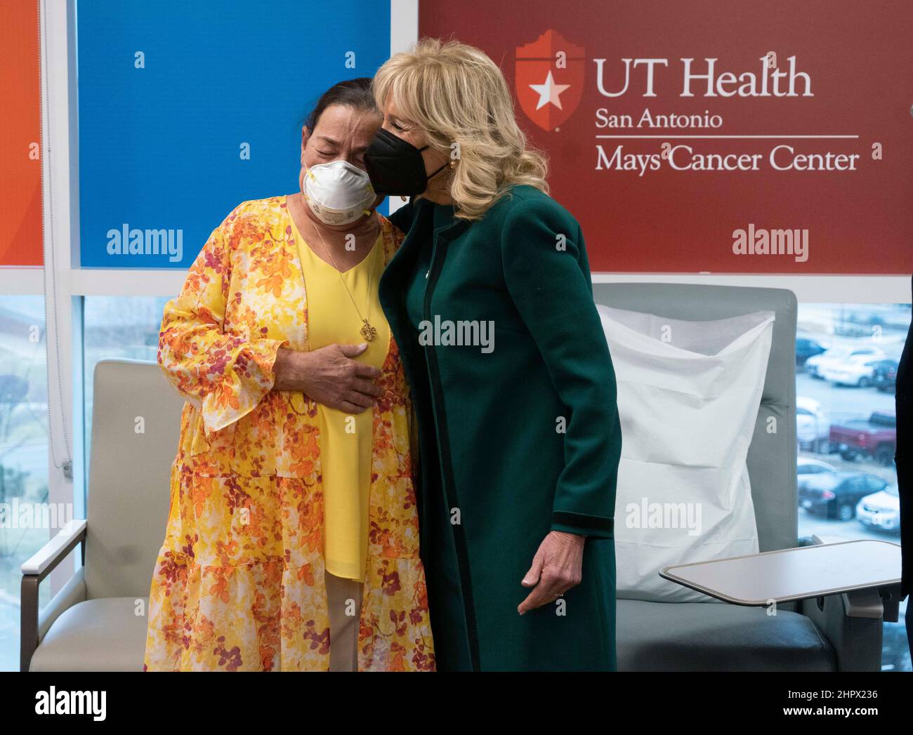 San Antonio Texas USA, Feb. 23, 2022: Cancer patient RAINEE MILLER, l, tears up as U.S. First Lady JILL BIDEN visits the Mays Cancer Center and gives her a hug during a tour of the UT Health MD Anderson Cancer Center in San Antonio. Biden listened to patients stories and heard from doctors on the front lines of the battle against cancer. Credit: Bob Daemmrich/Alamy Live News Stock Photo
