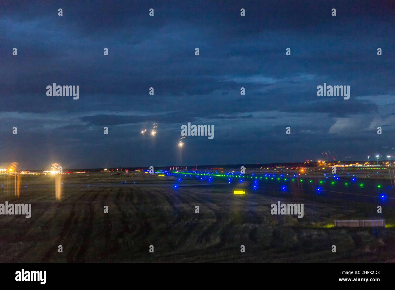 landing aircrafte at the Rhein -Main airport in Frankfurt by night Stock Photo