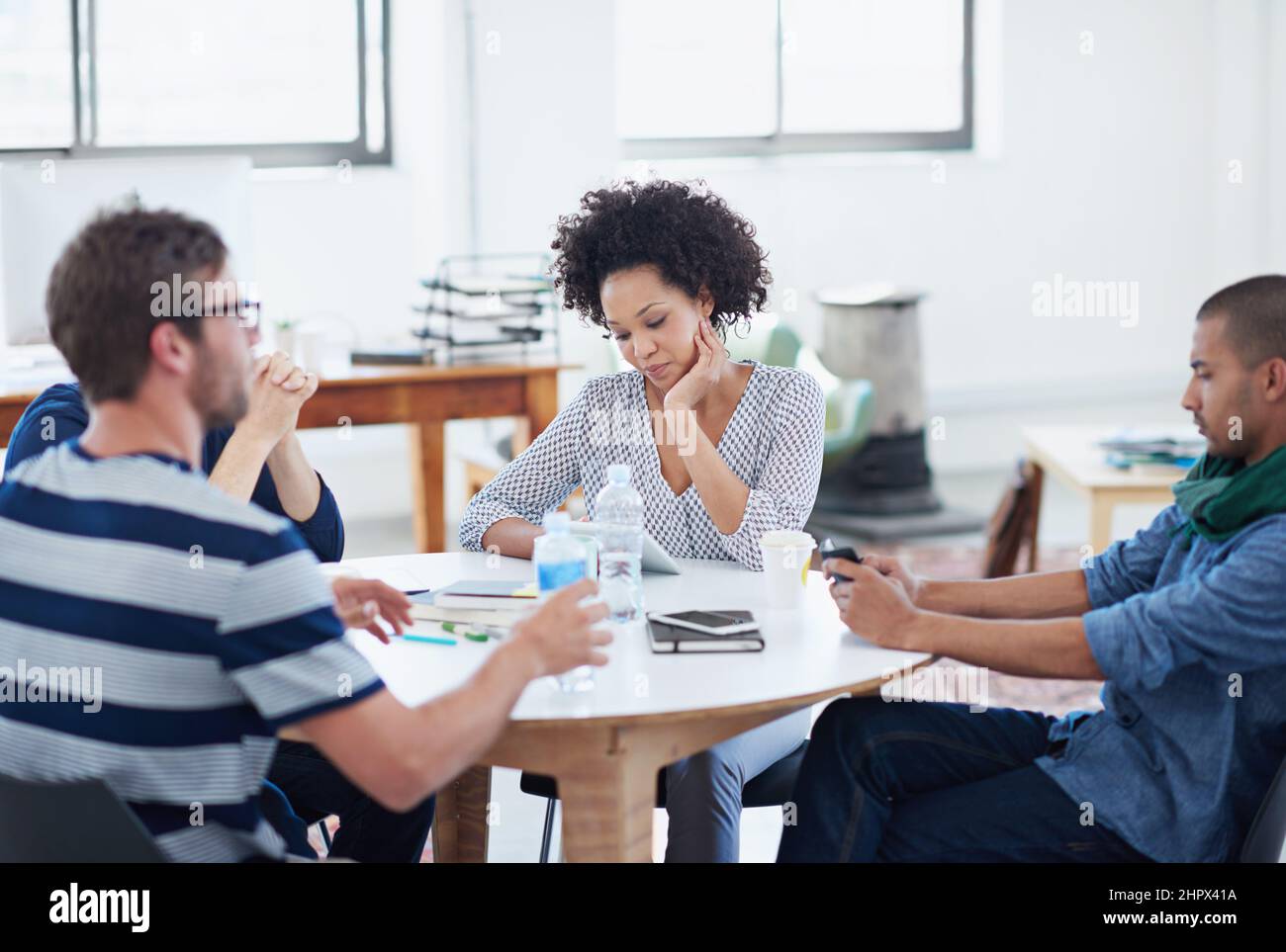 Exchanging great ideas. Shot of young designers at work in an office. Stock Photo