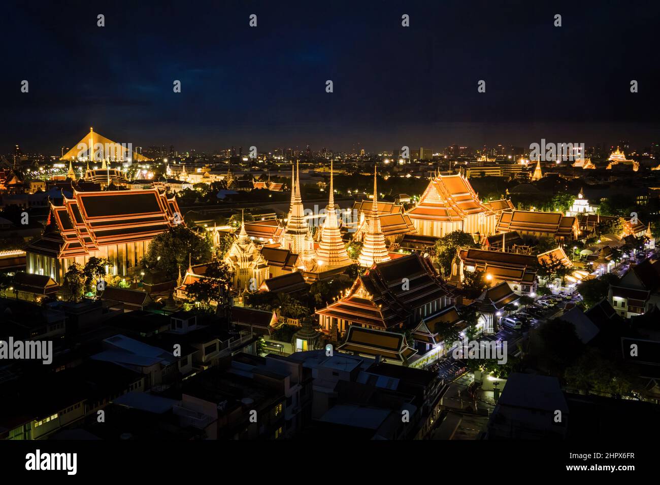 July 25, 2021, Bangkok, Thailand: (EDITOR'S NOTE: Image taken with drone).Aerial view of the Grand Palace in Bangkok.Two of Thailand's most famous cultural heritage sites and tourist attractions, Wat Arun (Temple of Dawn) and The Grand Palace, are illuminated at night along the Chao Praya River in Bangkok. The Thai Government recently announced eased entry requirements for international tourists visiting Thailand amidst a surge in the Omicron variant of COVID-19 throughout the country, with cases topping 20,000 reported infections per day. (Credit Image: © Matt Hunt/SOPA Images via ZUMA Press Stock Photo