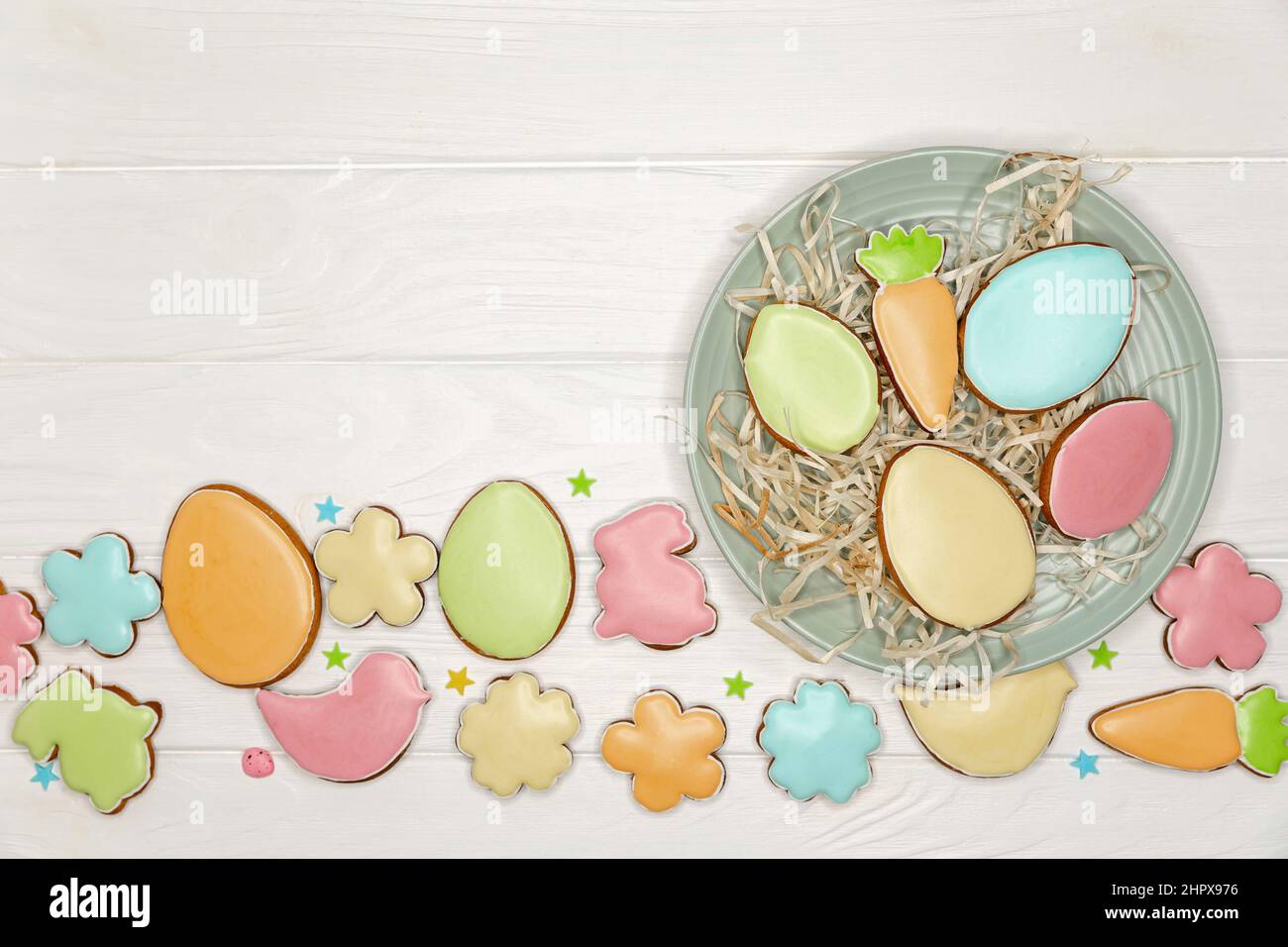 Beautiful glazed Easter cookies on white background with copy space. Stock Photo