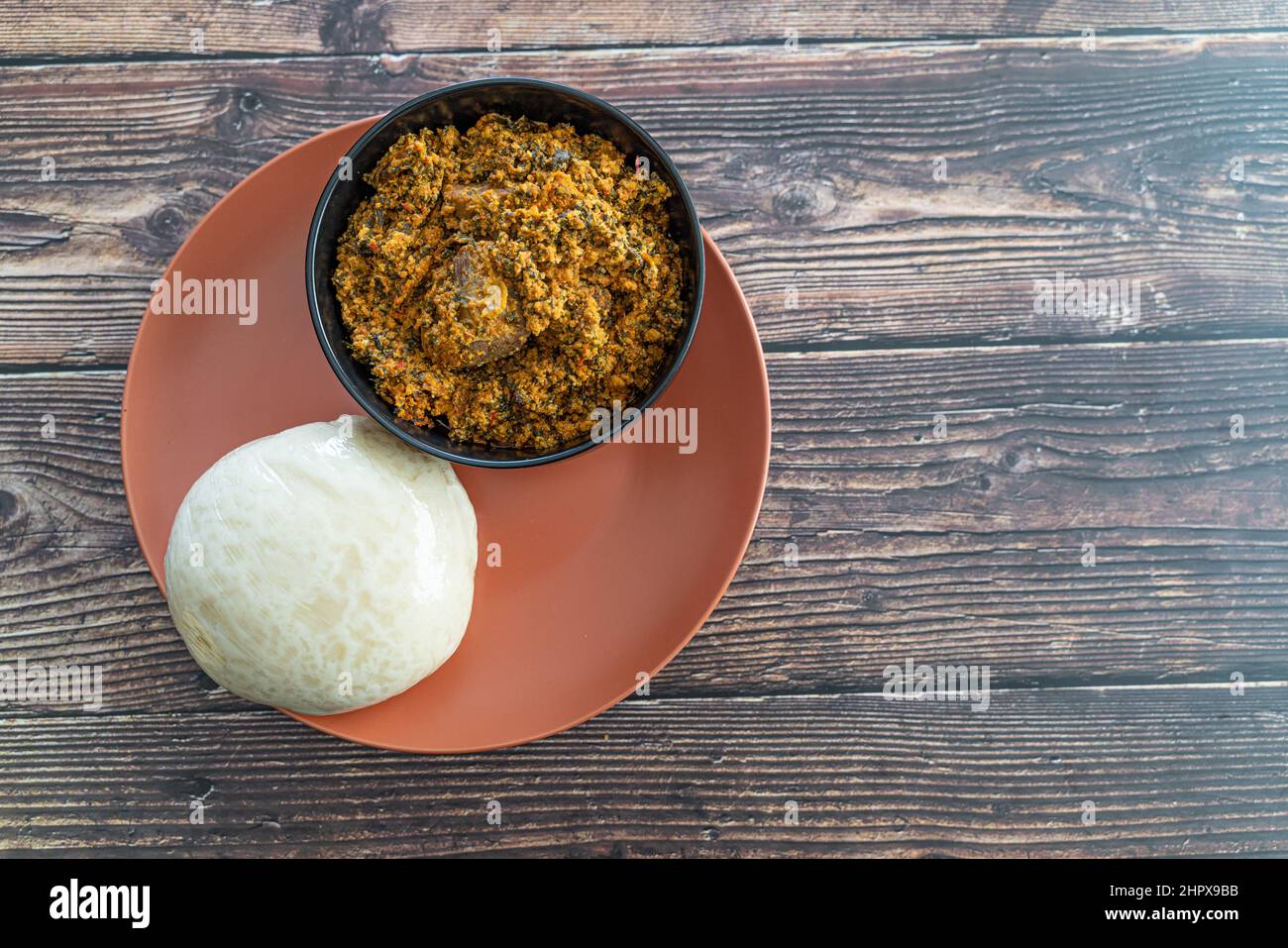 Nigerian Pounded Yam Served with Egusi Soup ready to eat Stock Photo