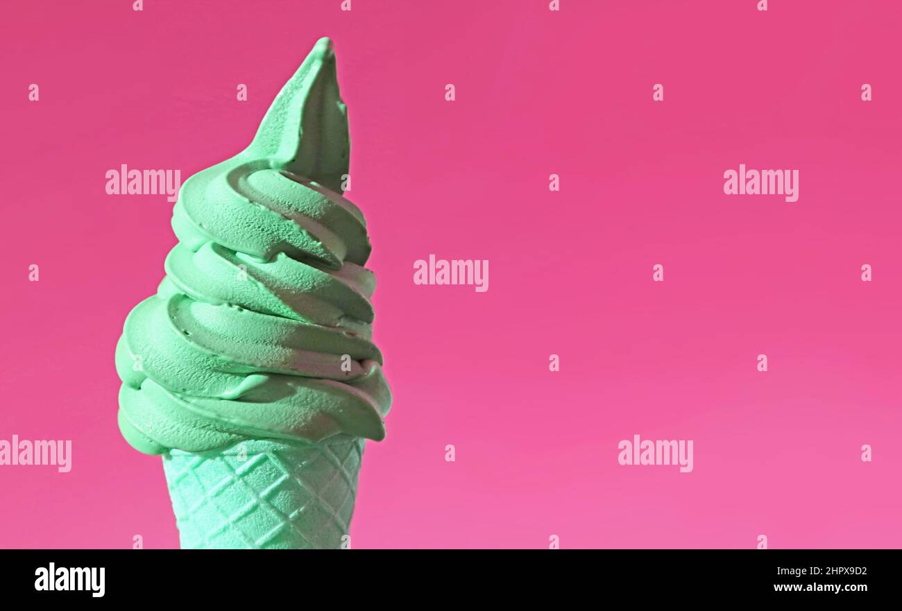 Pastel Green Pistachio Flavored Soft Serve Ice Cream Cone on Bubblegum