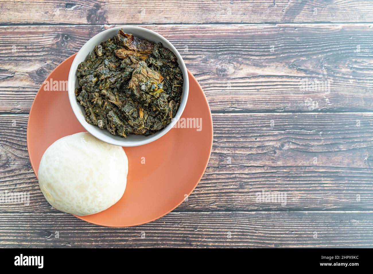 Nigerian Pounded Yam Served with Afang Soup ready to eat Stock Photo