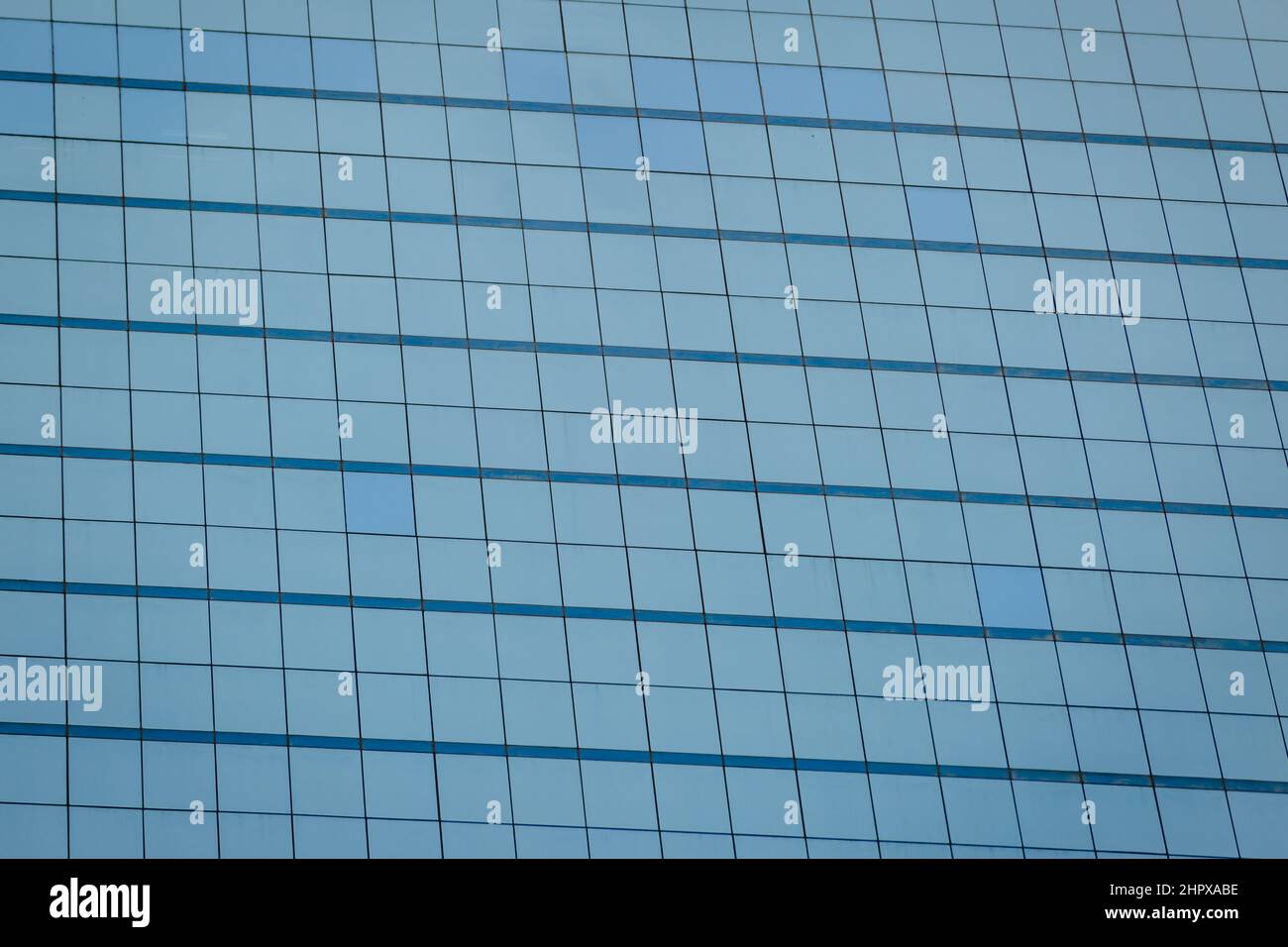 Blue glass windows of office building for background Stock Photo - Alamy