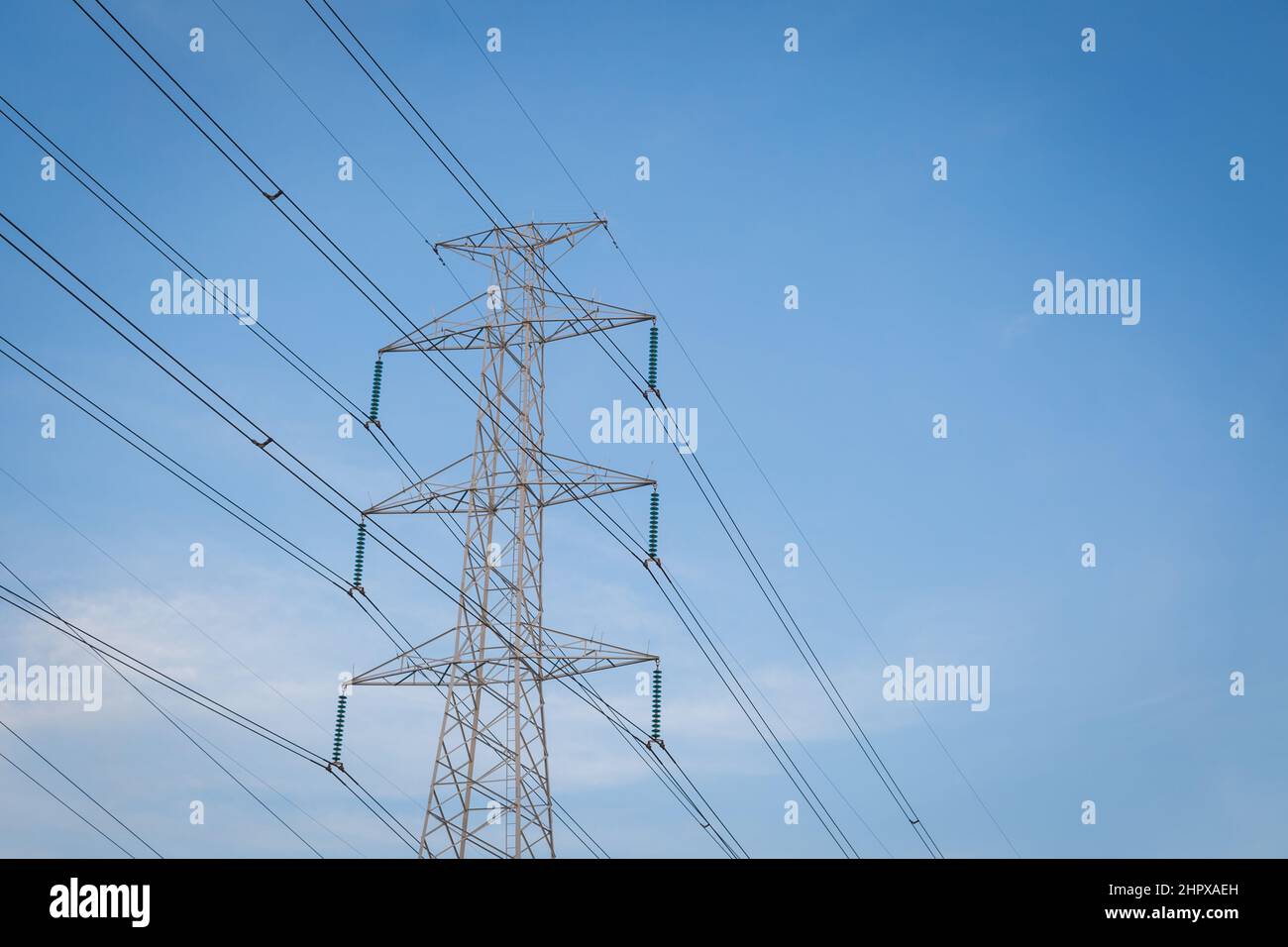 High voltage post tower with blue sky before sunset background Stock ...