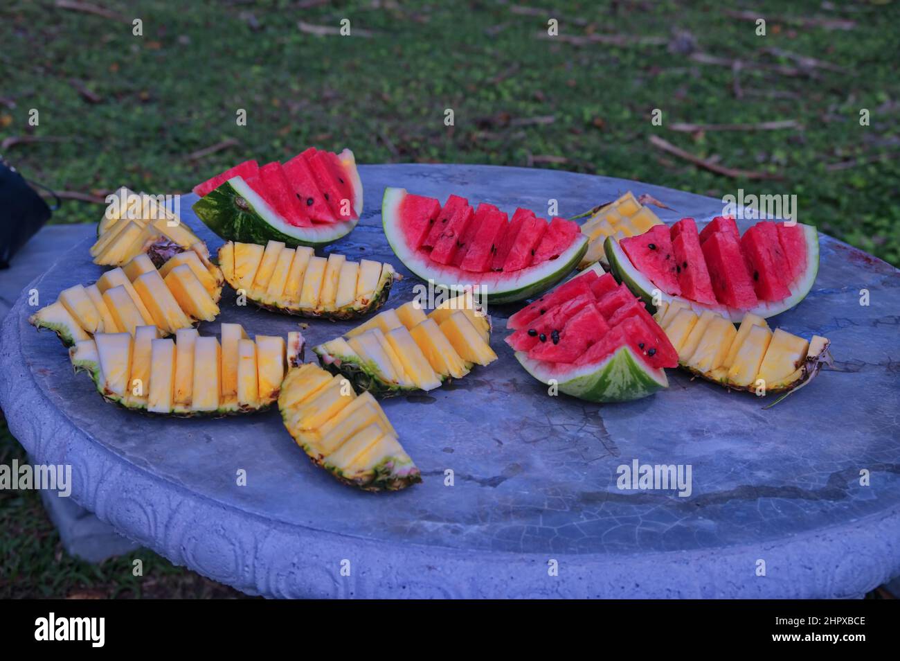 Fresh tropical fruit on stone table after hiking in Costa Rica Stock Photo