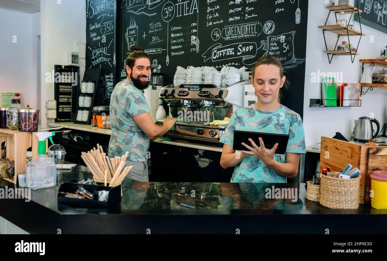 Smiling coffee shop workers posing Stock Photo