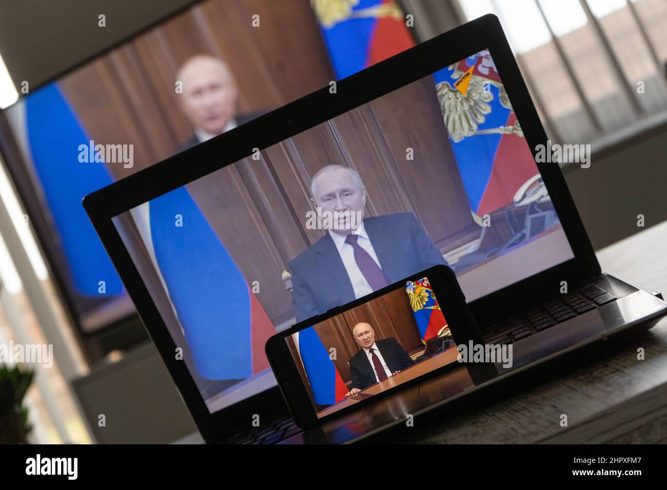 Watching Vladimir Putin on TV. President of Rusia Vladimir Putin declares war to Ukraine Stock Photo