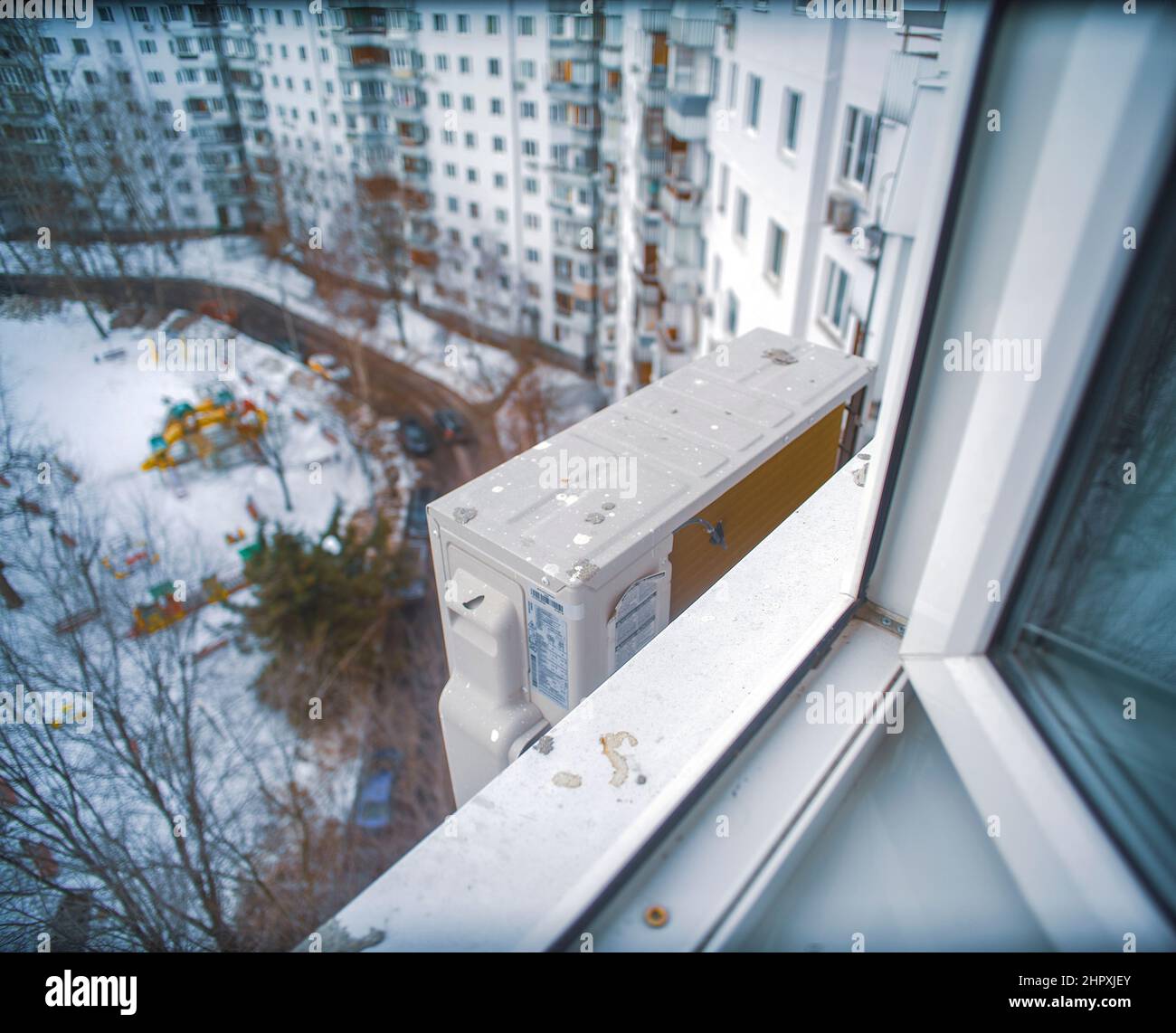 air conditioner block maintened outside the window, winter cityscape Stock Photo Alamy