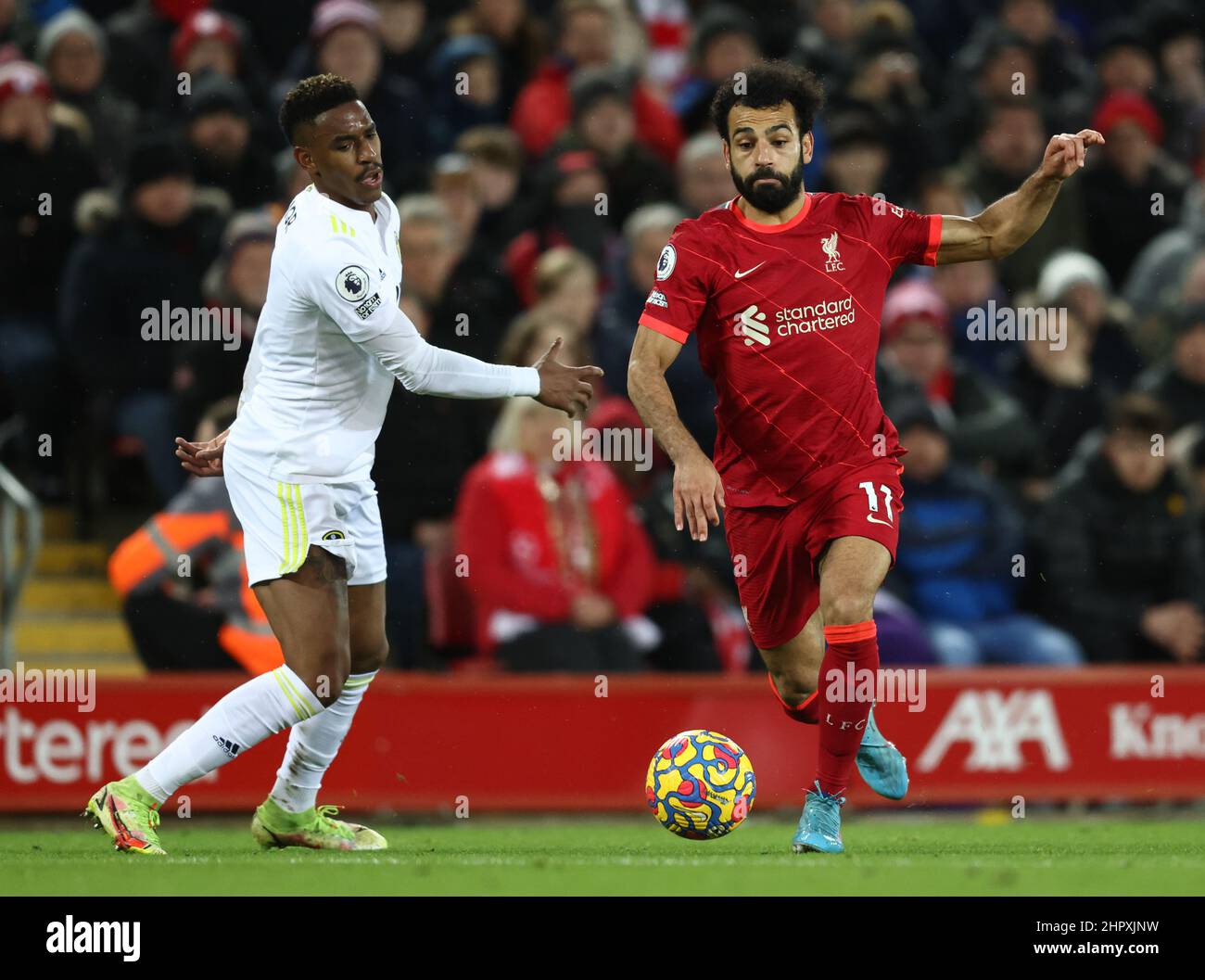 Liverpool, England, 23rd February 2022.  Junior Firpo of Leeds United challenges Mohamed Salah of Liverpool during the Premier League match at Anfield, Liverpool. Picture credit should read: Darren Staples / Sportimage Stock Photo