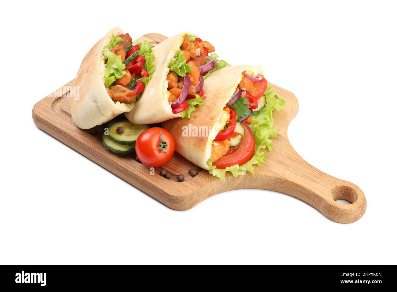 Board with pitas with chicken meat isolated on white background Stock Photo