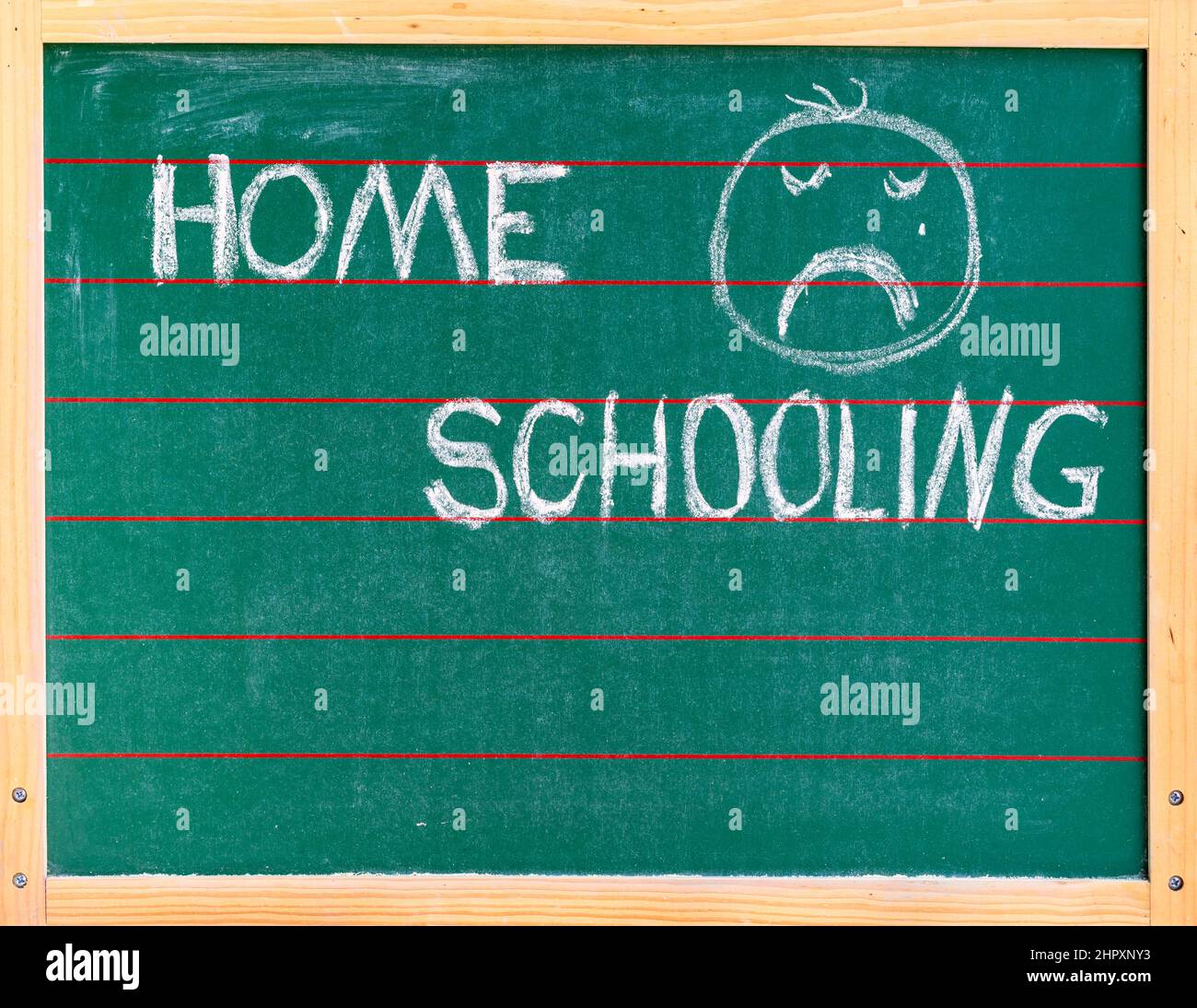 chalk-board-with-the-word-homeschooling-and-a-sad-face-stock-photo-alamy