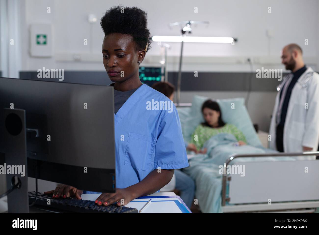 African american nurse using personal computer for clinical imaging in