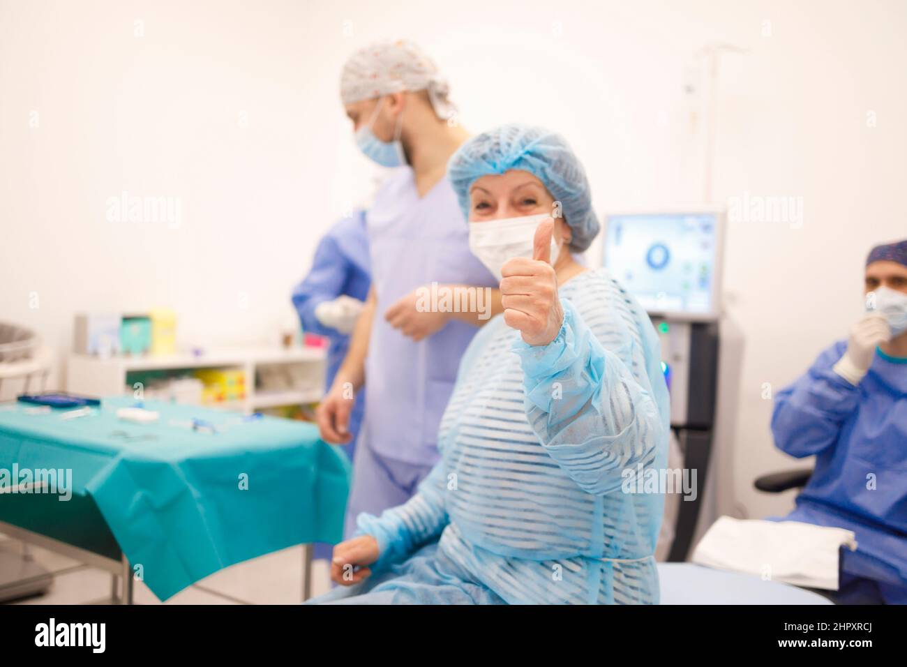 A senior patient showing OK sigh before the operation Stock Photo