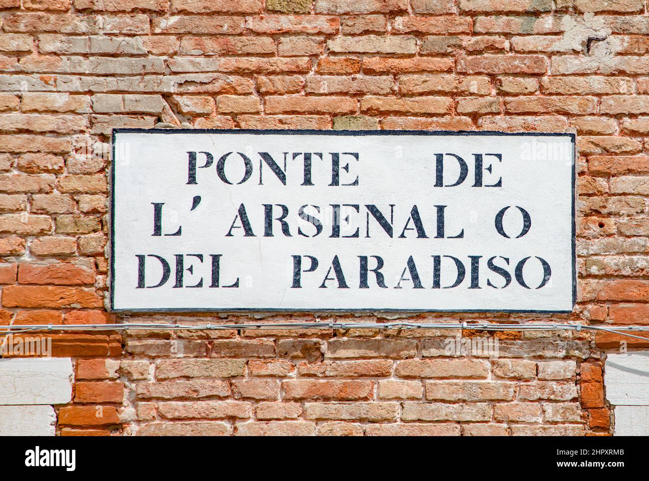 historic signage Ponte de l'Arsenale o del Paradiso(engl: area of the Arsenal or the paradise  area) in Venice, Italy,  the shipyard area in Venice Stock Photo