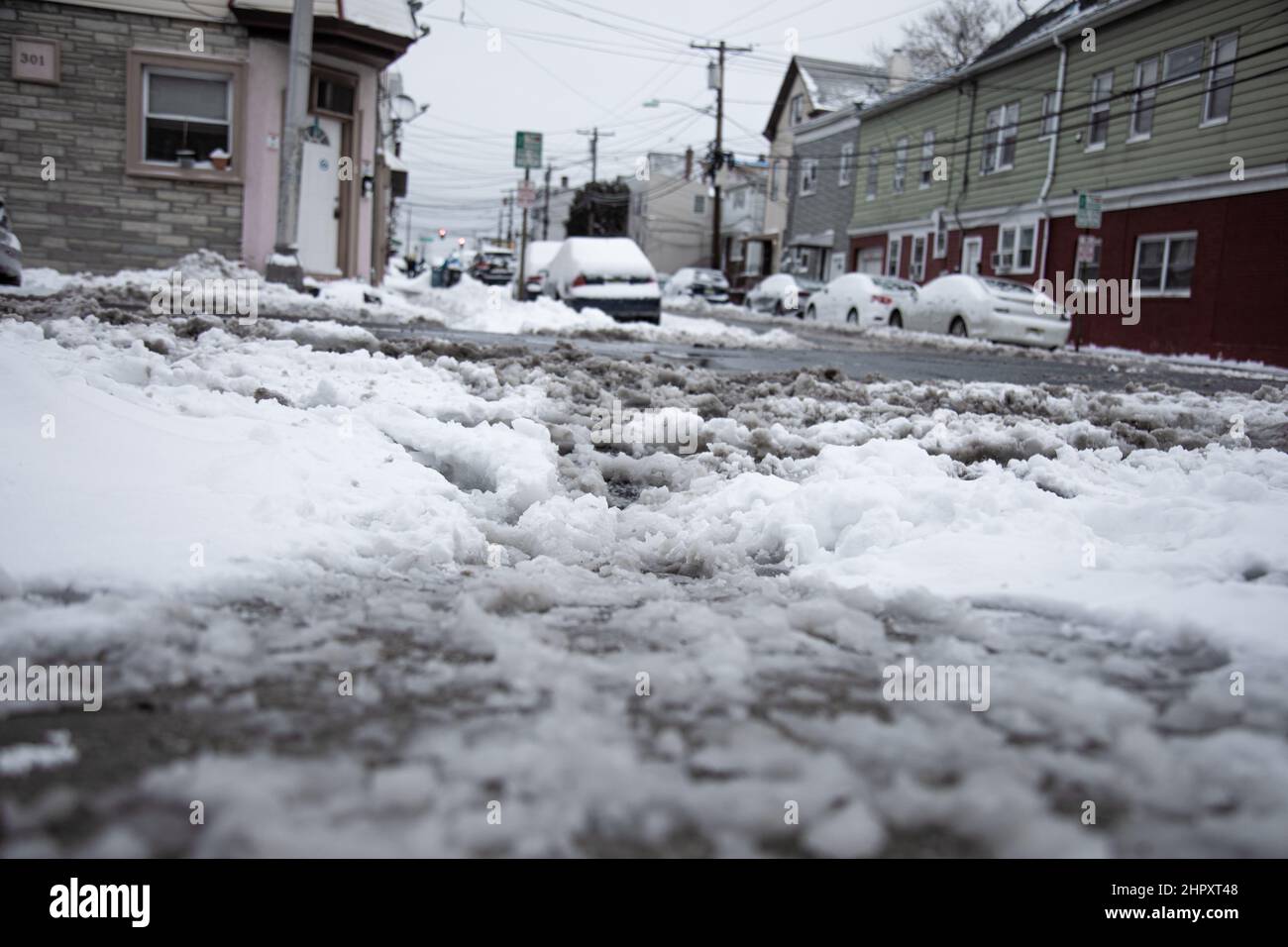 Low angle shot of cars and streets covered with snow Stock Photo - Alamy