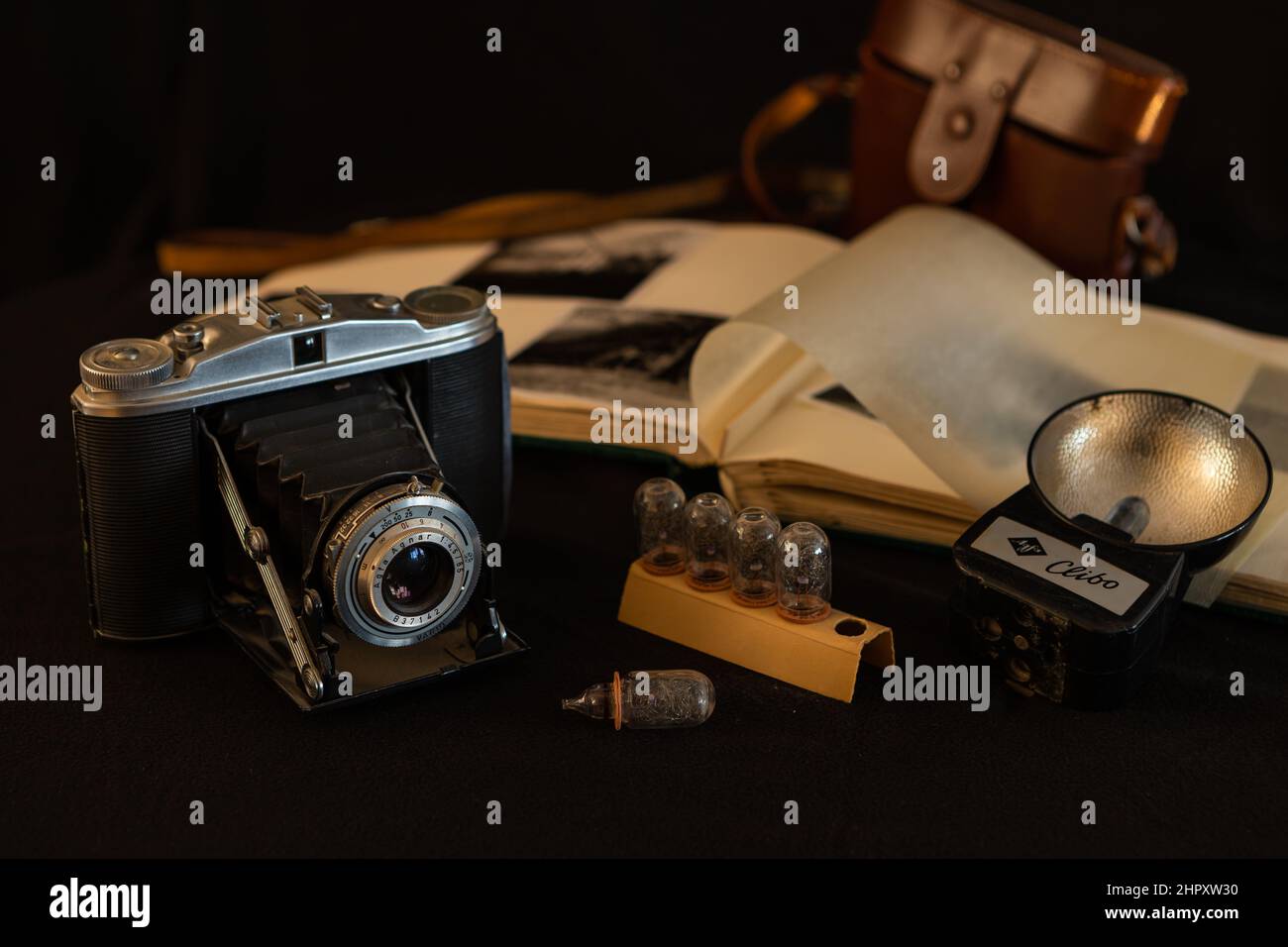 Old photo camera with flash lamps and flash, still life, low key image Stock Photo