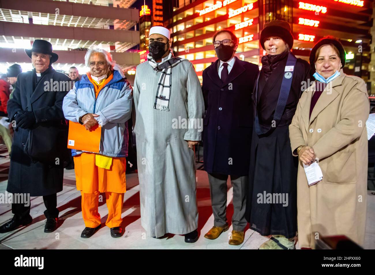 Reno, United States. 23rd Feb, 2022. Various religious leaders pose for a photo at the vigil in City Plaza. Community members and religious leaders gathered in the city plaza for a candle light vigil to remember the 52 homeless individuals who had died in the past year. Credit: SOPA Images Limited/Alamy Live News Stock Photo