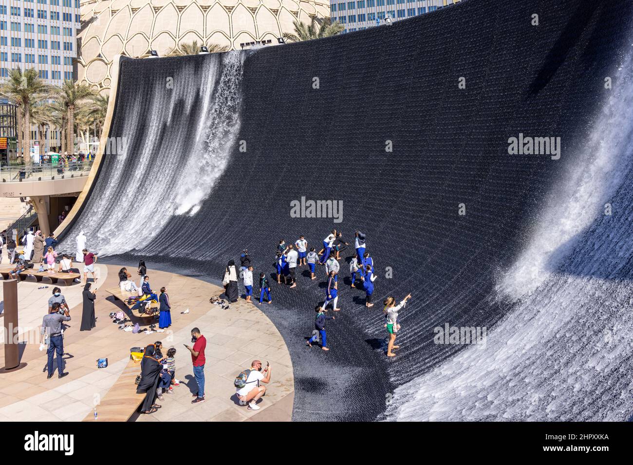 Visitors enjoying the surreal water feature in Jubilee Park at Dubai Expo 2020, United Arab Emirates. Stock Photo