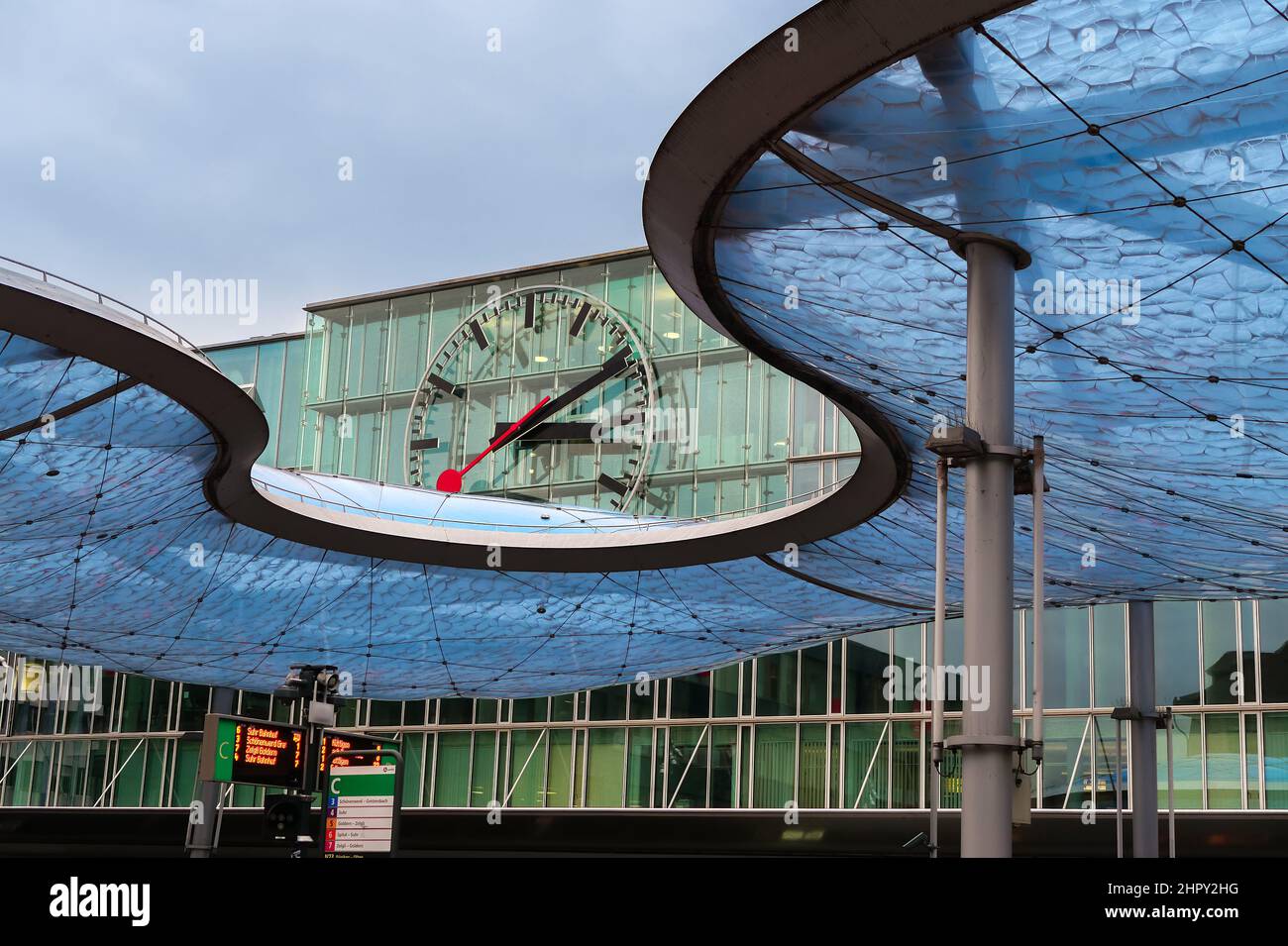 Aarau, Switzerland - November 3, 2021: Modernly designed blue roof of a bus station in Aarau and a watch Stock Photo