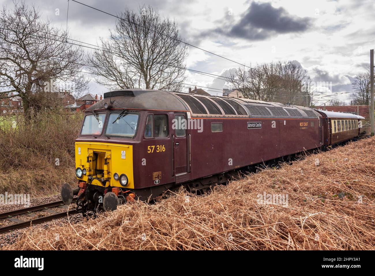 British Rail Class 57  diesel locomotive named Alnwick Castle  remanufactured from Class 47s by Brush Traction. Seen here at Golborne Junction Stock Photo