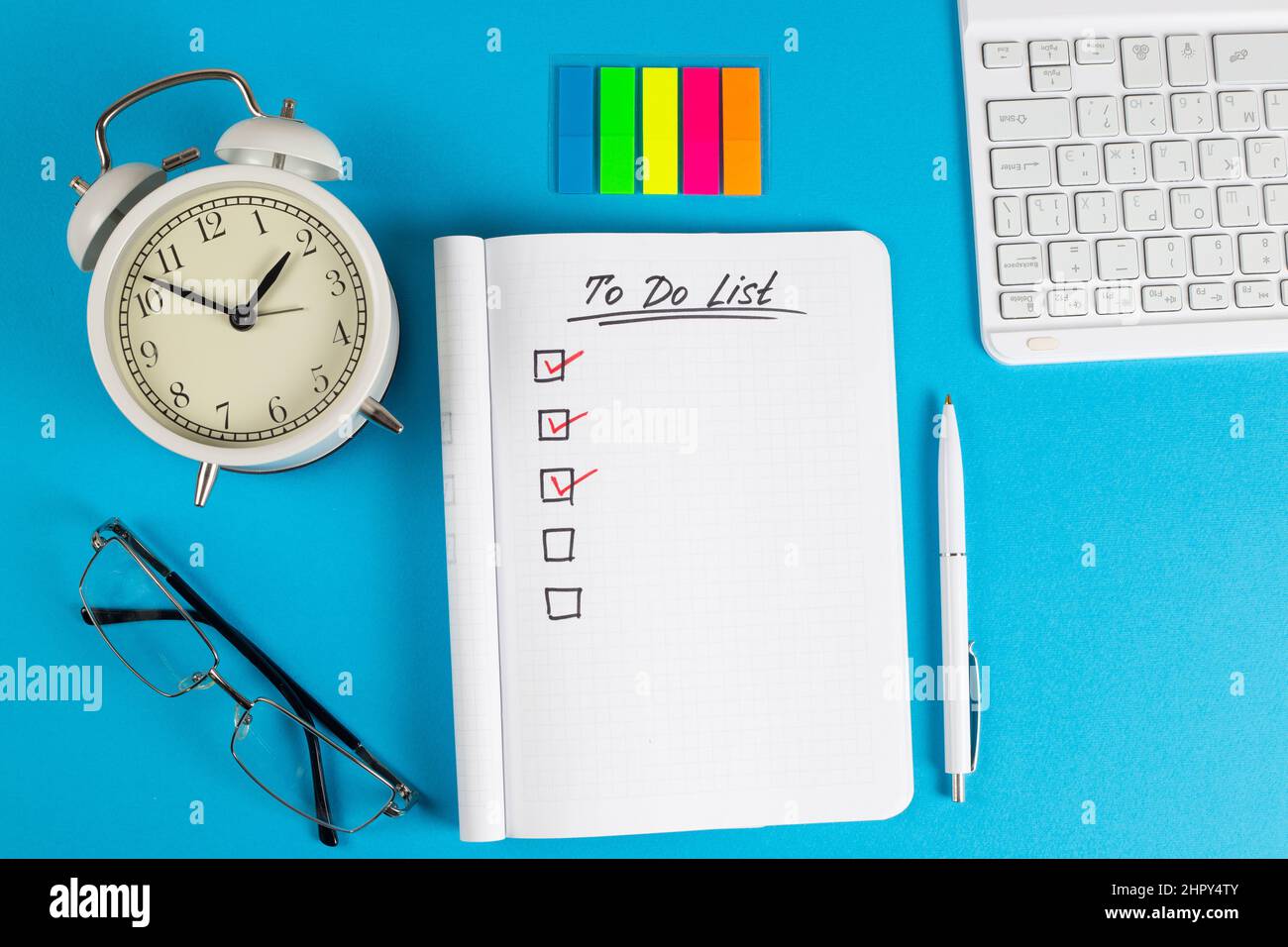 To do list in notebook plan. Top view, flat lay, copy space. Stock Photo
