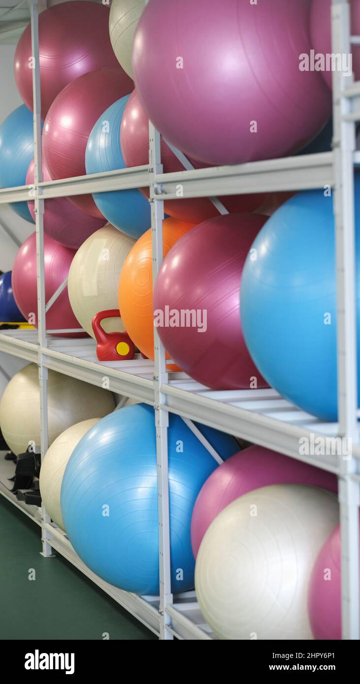 physical therapy fitballs on a shelf in a rehabilitation center