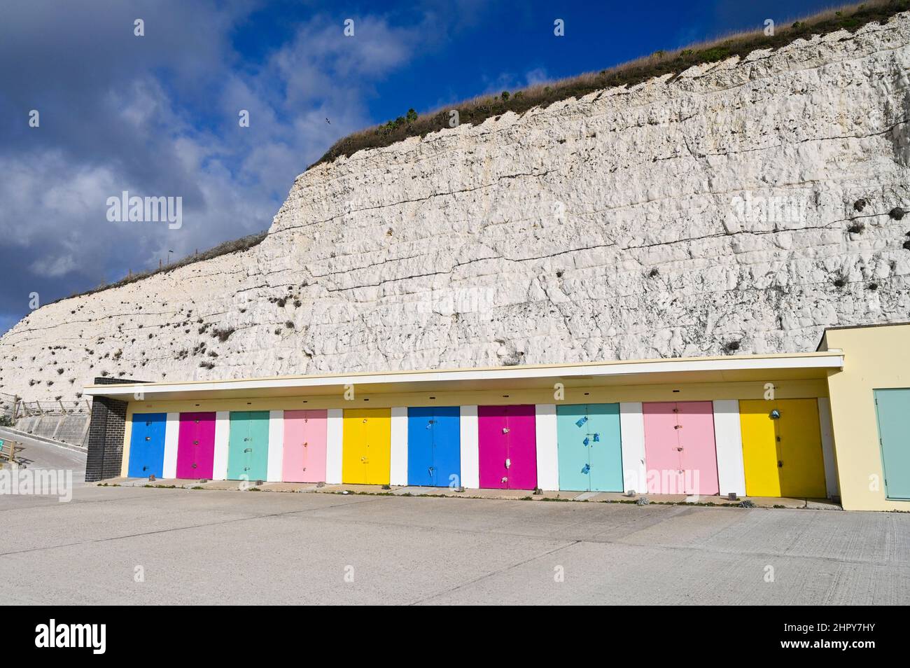 Saltdean Undercliff Walk with colourful beach huts locked up in winter Stock Photo