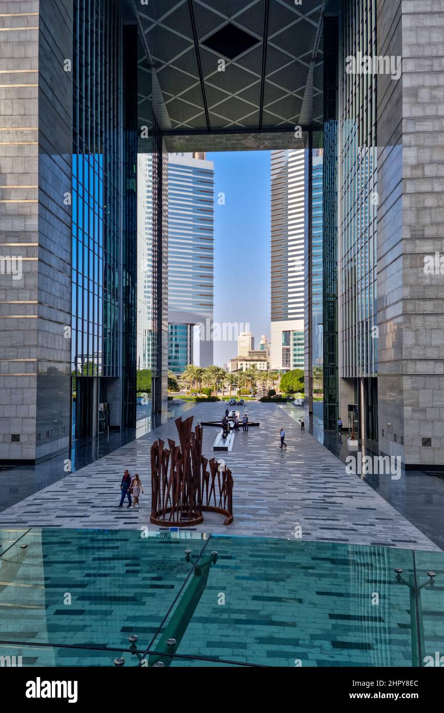 View through the Gate, with the Emirates Towers beyond, at DIFC Dubai International Financial Centre in Dubai, United Arab Emirates. Stock Photo