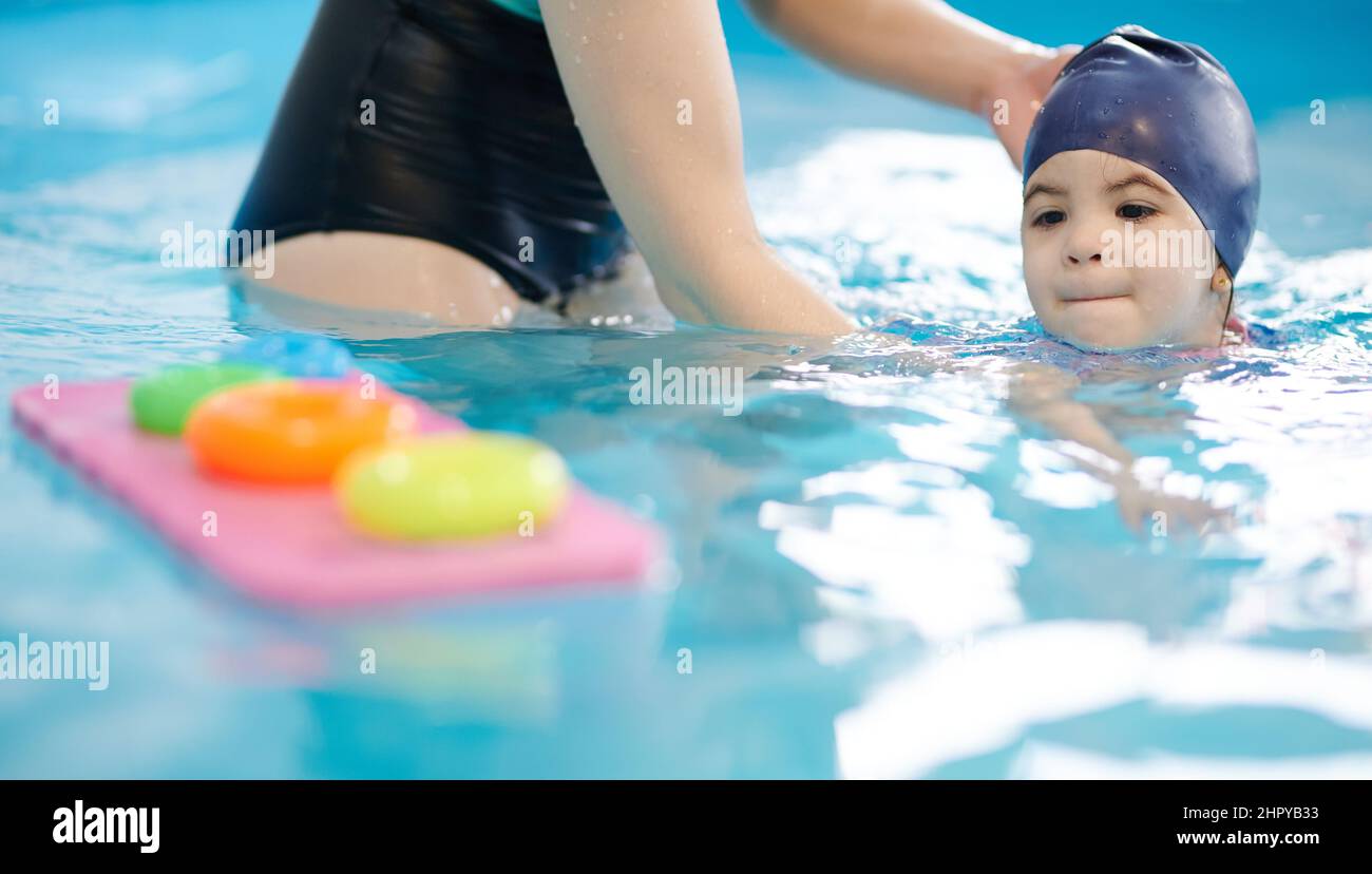 Swimming activity for kids theme. Learning to swim in aquapark classes