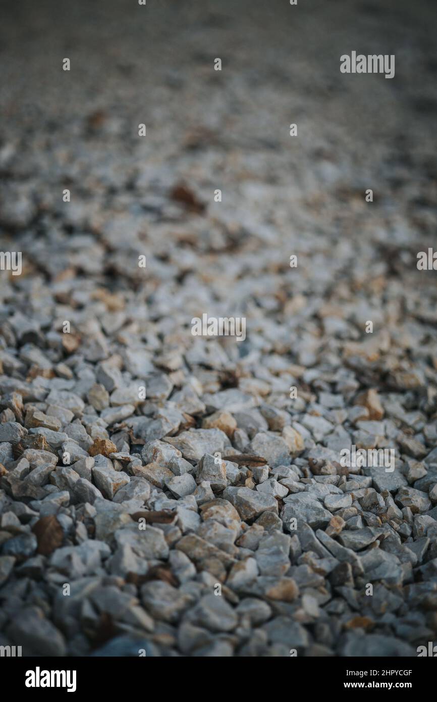 Small Rocks Side View Vertical shot of some small rocks at a beach near a sea Stock Photo - Alamy
