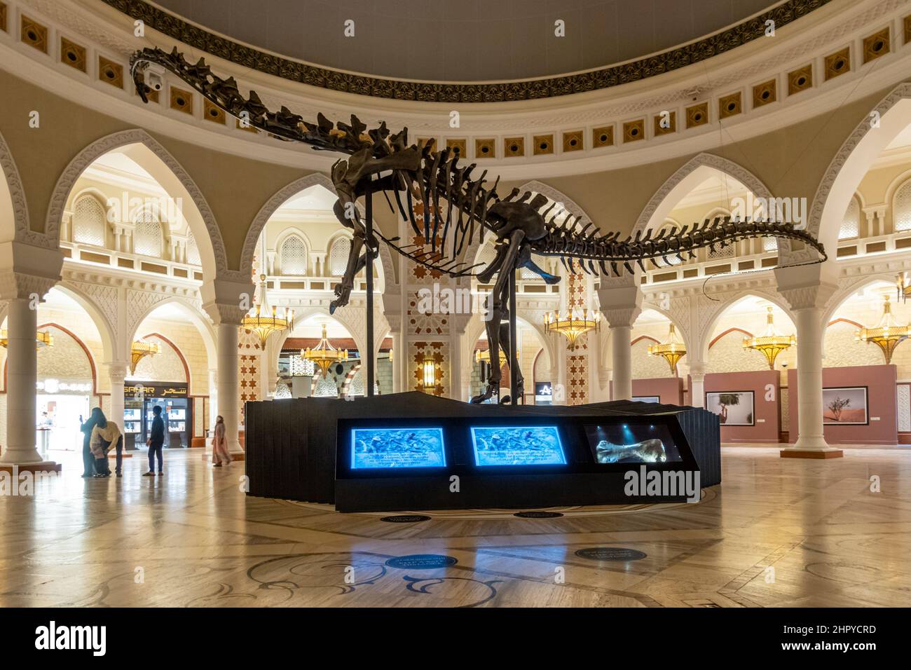 Dinosaur skeleton on display inside Middle Eastern styled The Souk shopping area inside the Dubai Mall, United Arab Emirates Stock Photo