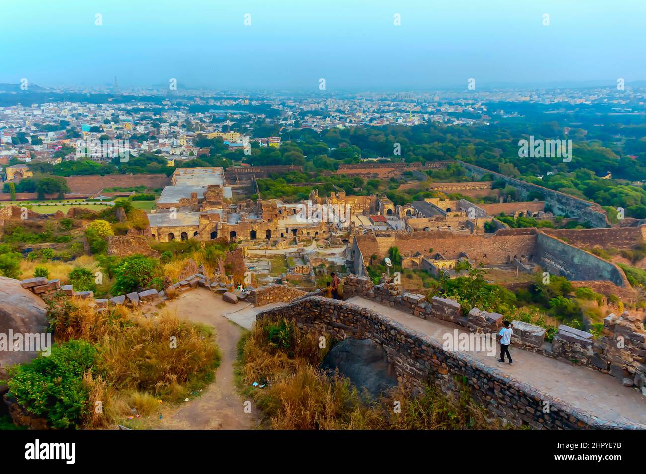A view of the inside of the Golconda Fort in Hyderabad, Telangana, India. The skyline of the city is visible in the background. Stock Photo