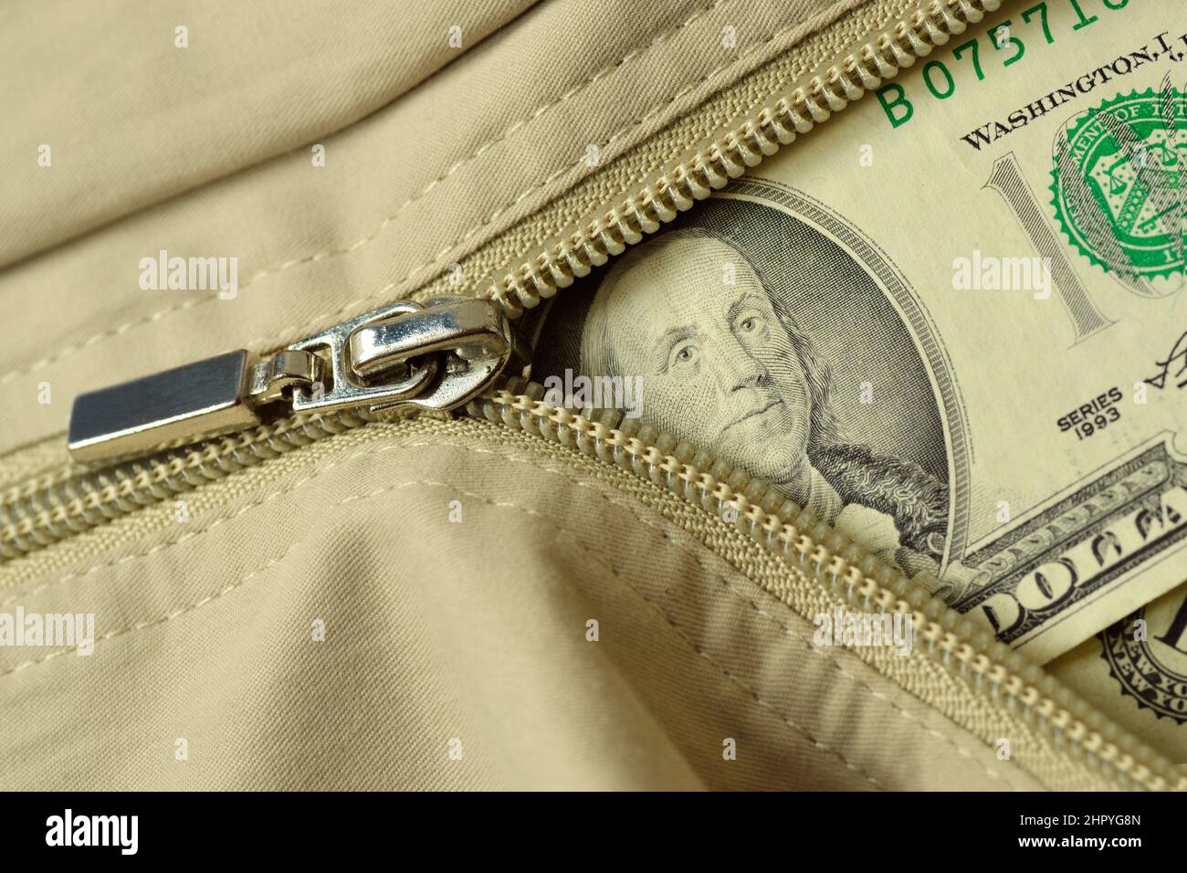 Zipper with dollar banknote - Concept of finance and economy Stock Photo