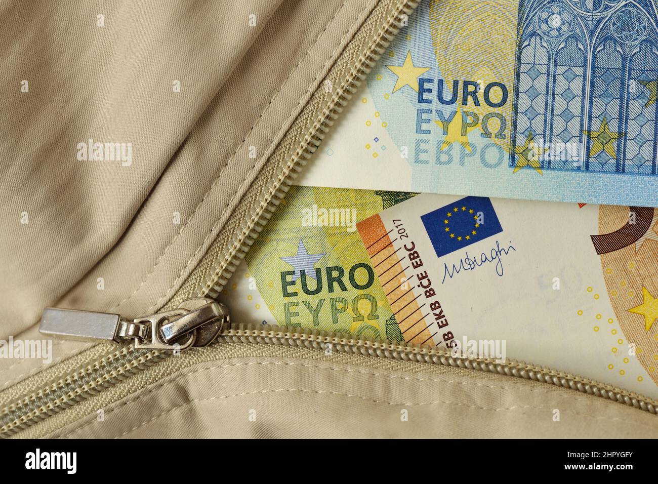 Zipper with euro banknotes - Concept of finance and economy Stock Photo