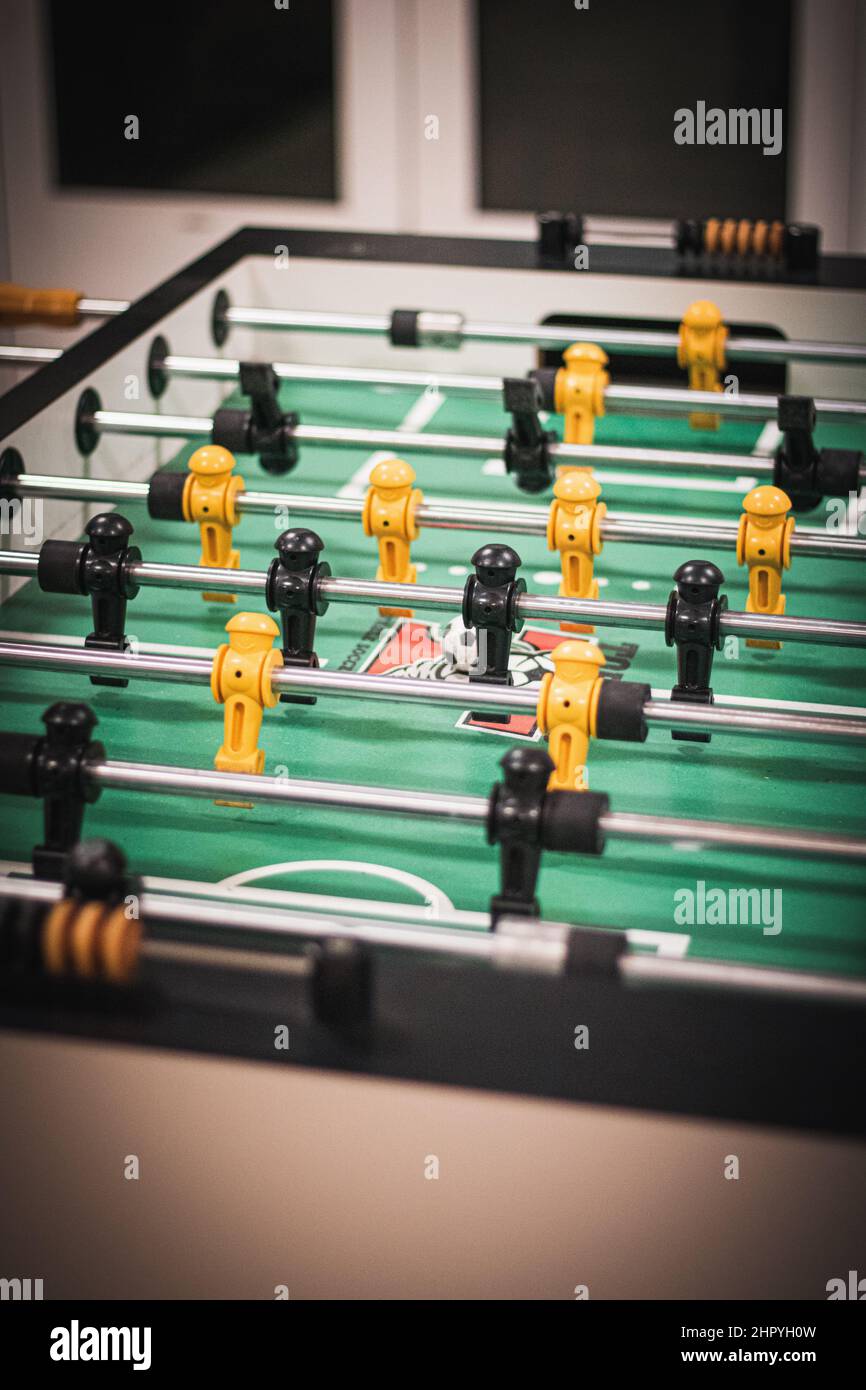 Vertical shot of table football with yellow and black players Stock Photo Alamy