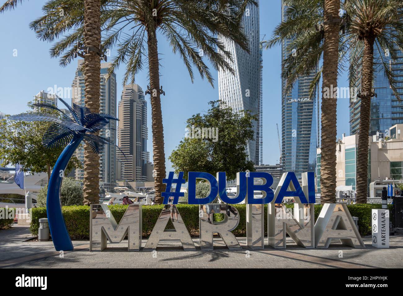 Dubai Marina sign with skyscrapers in the background, United Arab Emirates. Stock Photo