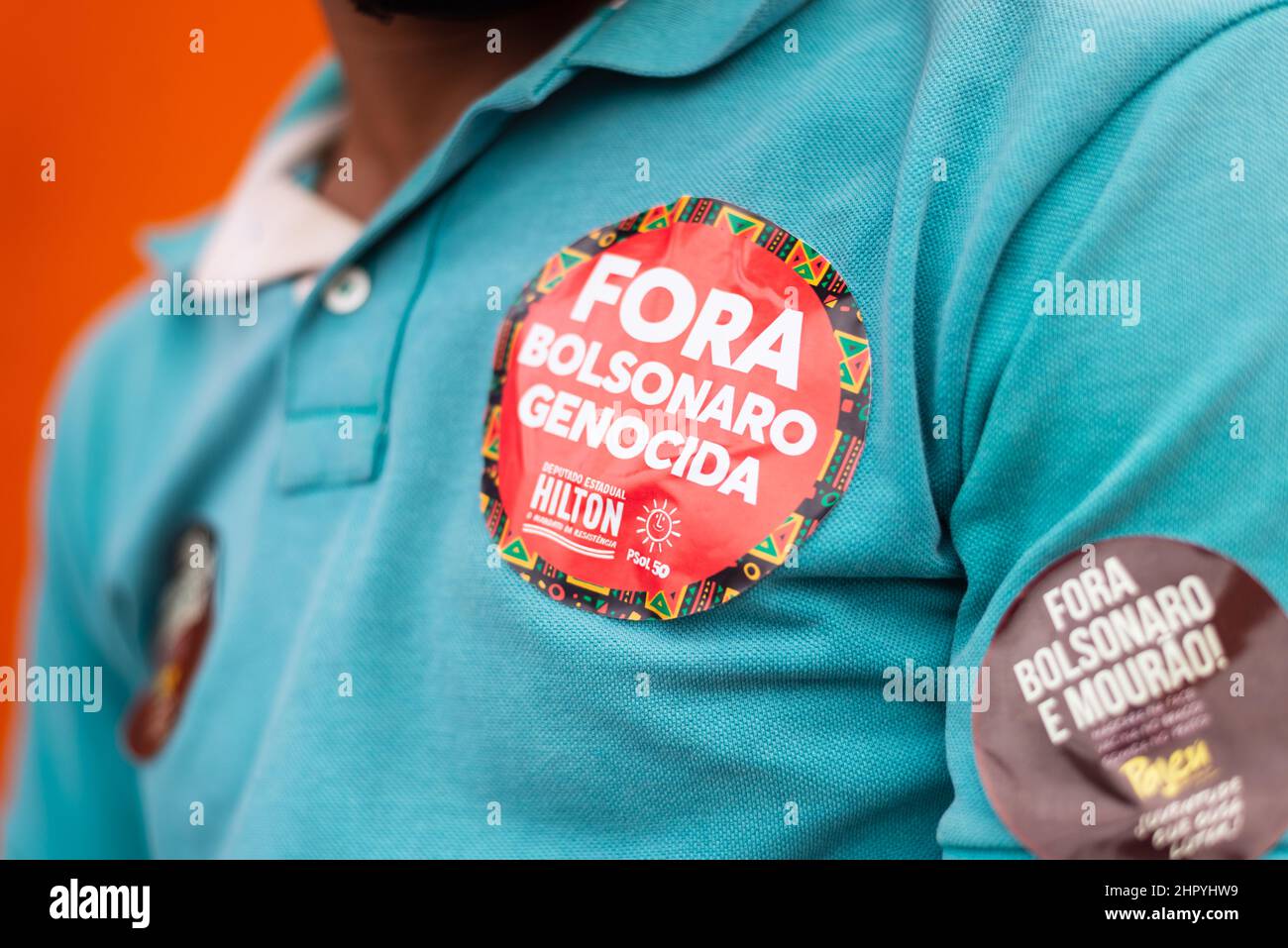 Closeup shot of stickers on a Brazilian's shirt protesting President Jair Bolsonaro Stock Photo