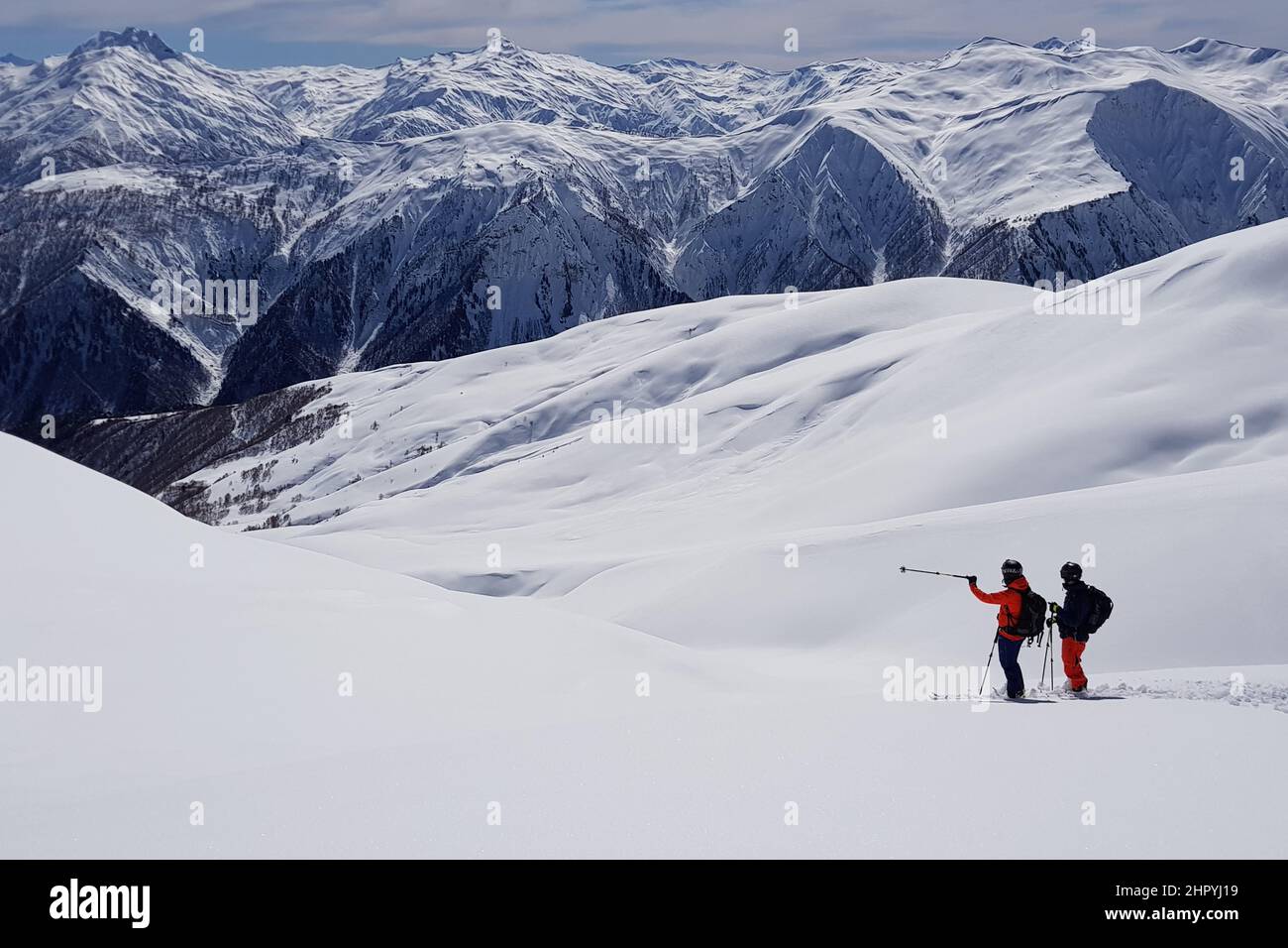 Chilling view of people hiking with trekking poles on a snowcovered